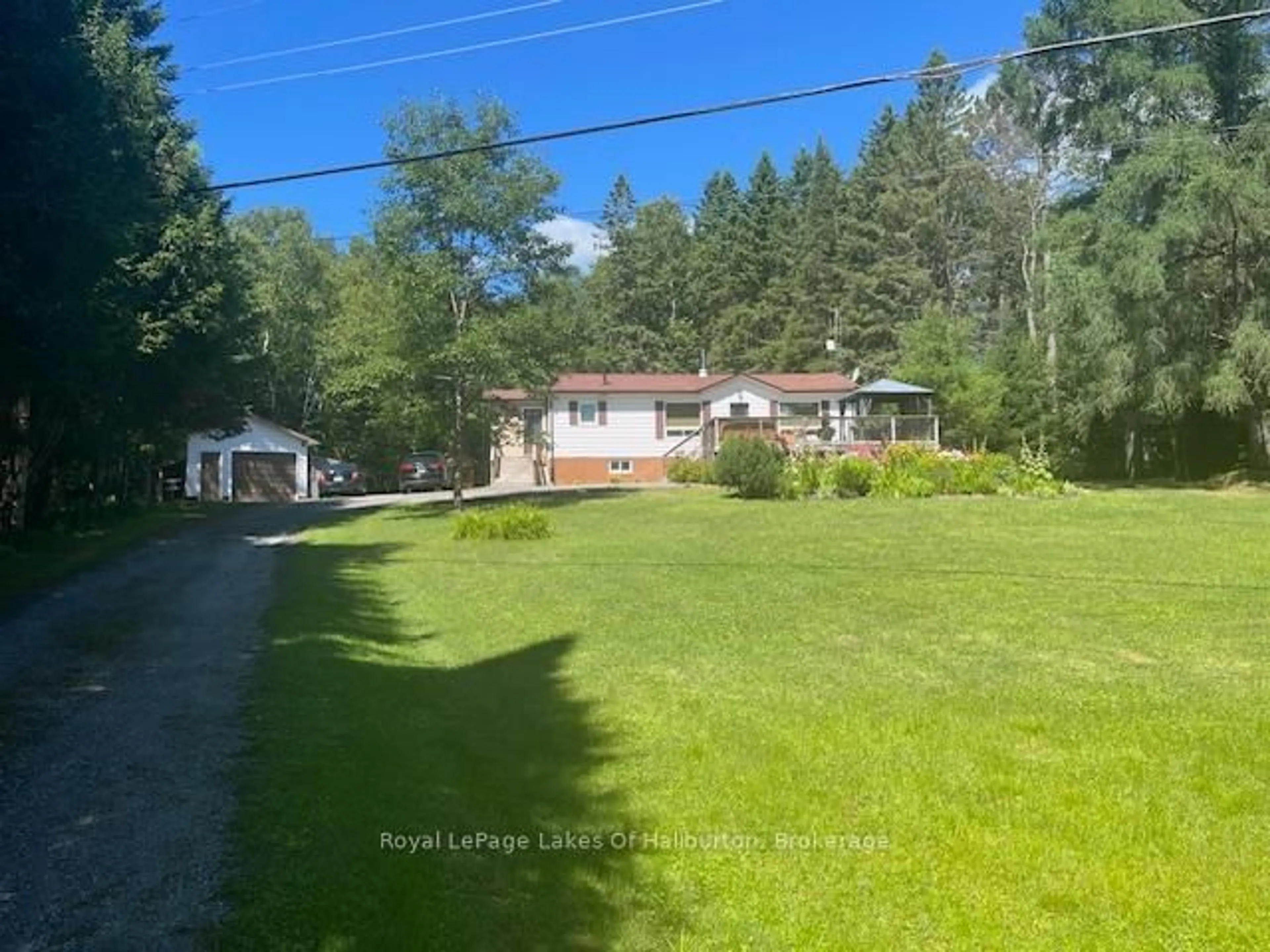 A pic from outside/outdoor area/front of a property/back of a property/a pic from drone, water/lake/river/ocean view for 1293 Green Lake Rd, Dysart et al Ontario K0M 1S0