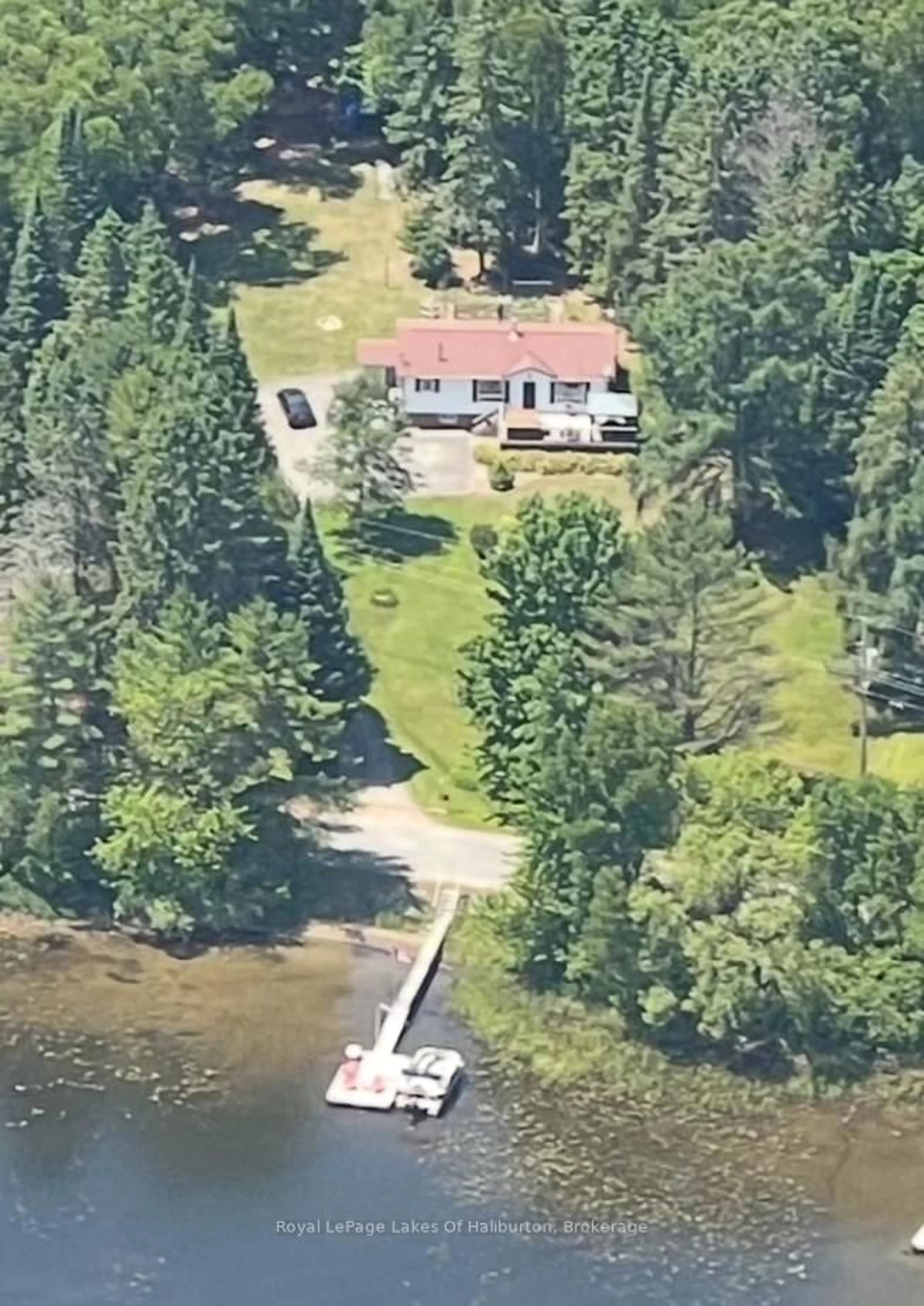 A pic from outside/outdoor area/front of a property/back of a property/a pic from drone, water/lake/river/ocean view for 1293 Green Lake Rd, Dysart et al Ontario K0M 1S0
