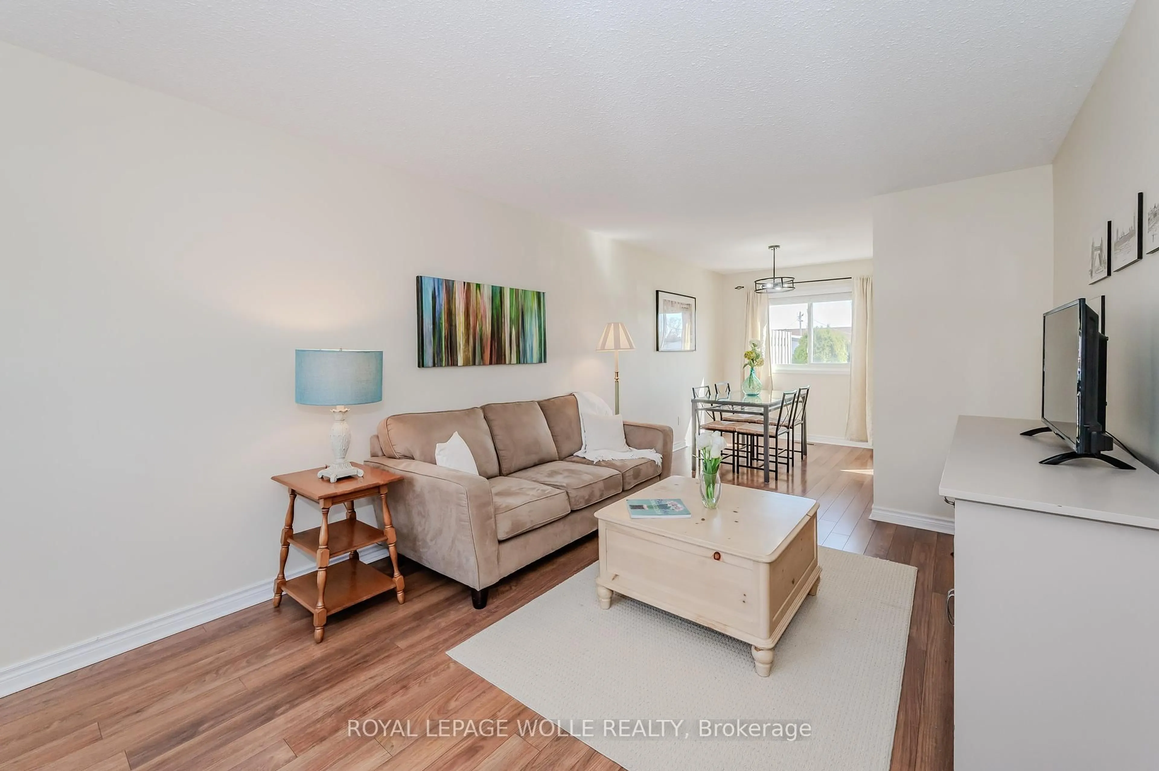 Living room with furniture, wood/laminate floor for 25 Upper Canada Dr #33, Kitchener Ontario N2P 1G2
