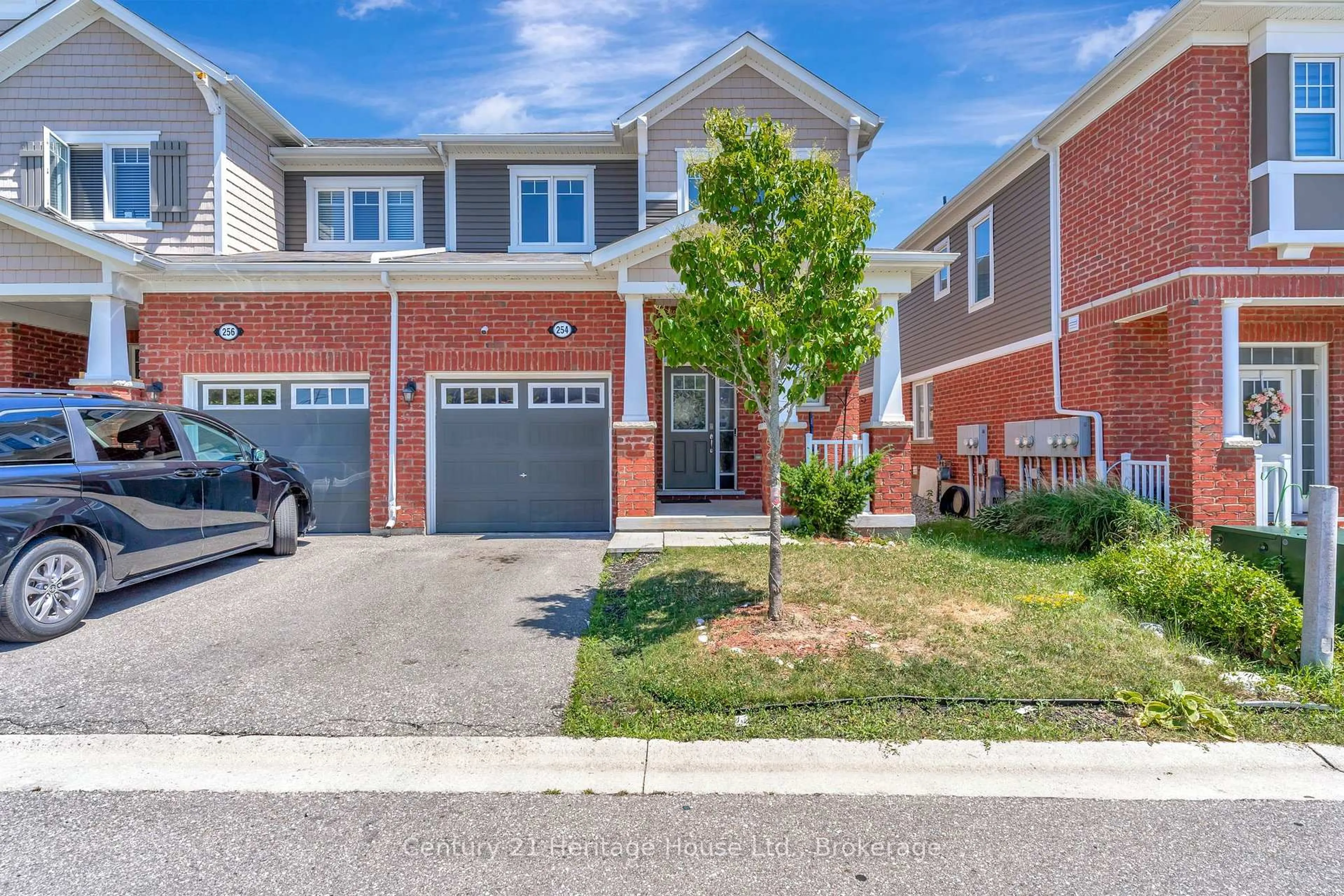 Home with brick exterior material, street for 254 Waterbrook Lane, Kitchener Ontario N2P 0H7