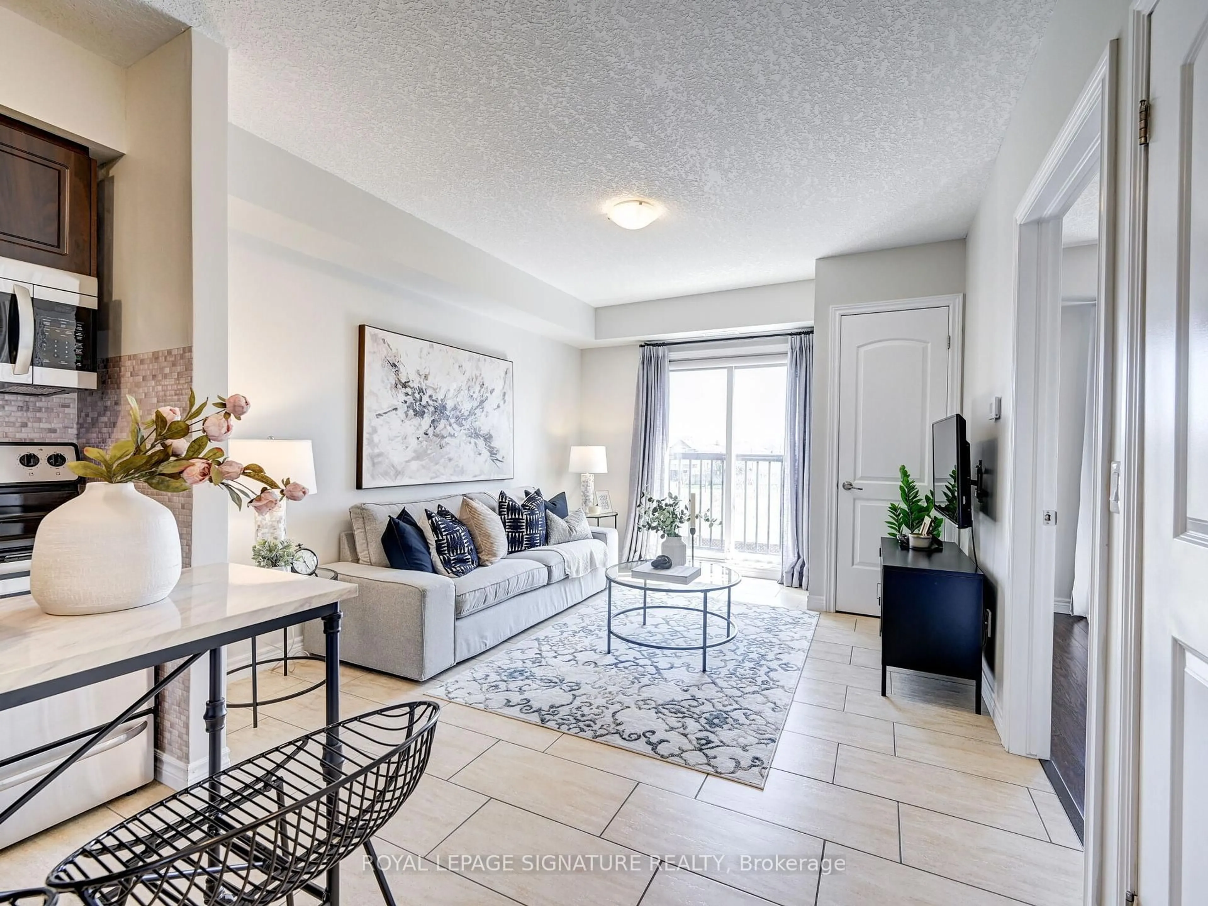 Living room with furniture, ceramic/tile floor for 886 Golf Links Rd #205, Hamilton Ontario L9K 1J8