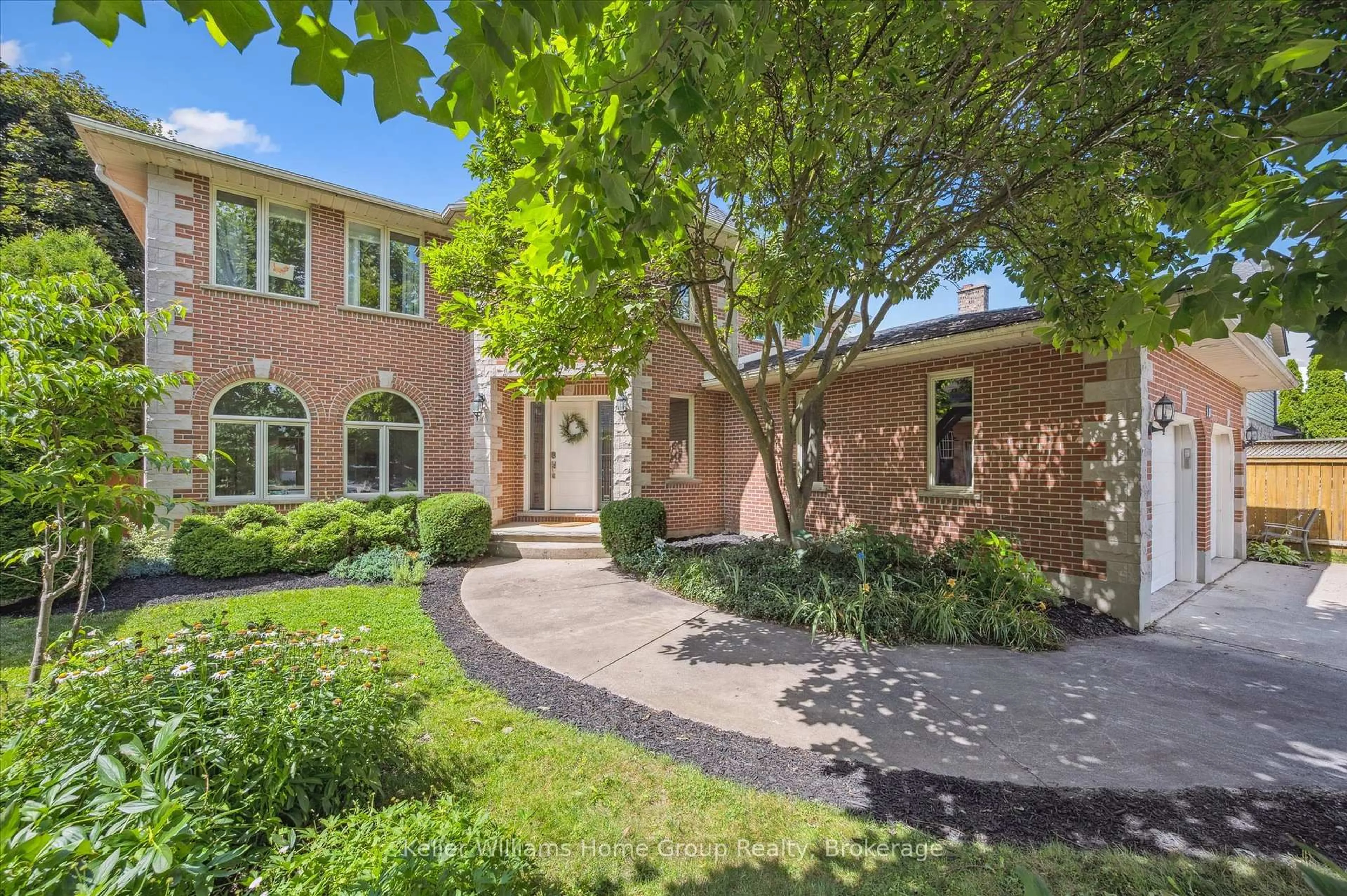 Home with brick exterior material, street for 12 Harts Lane, Guelph Ontario N1L 1B1