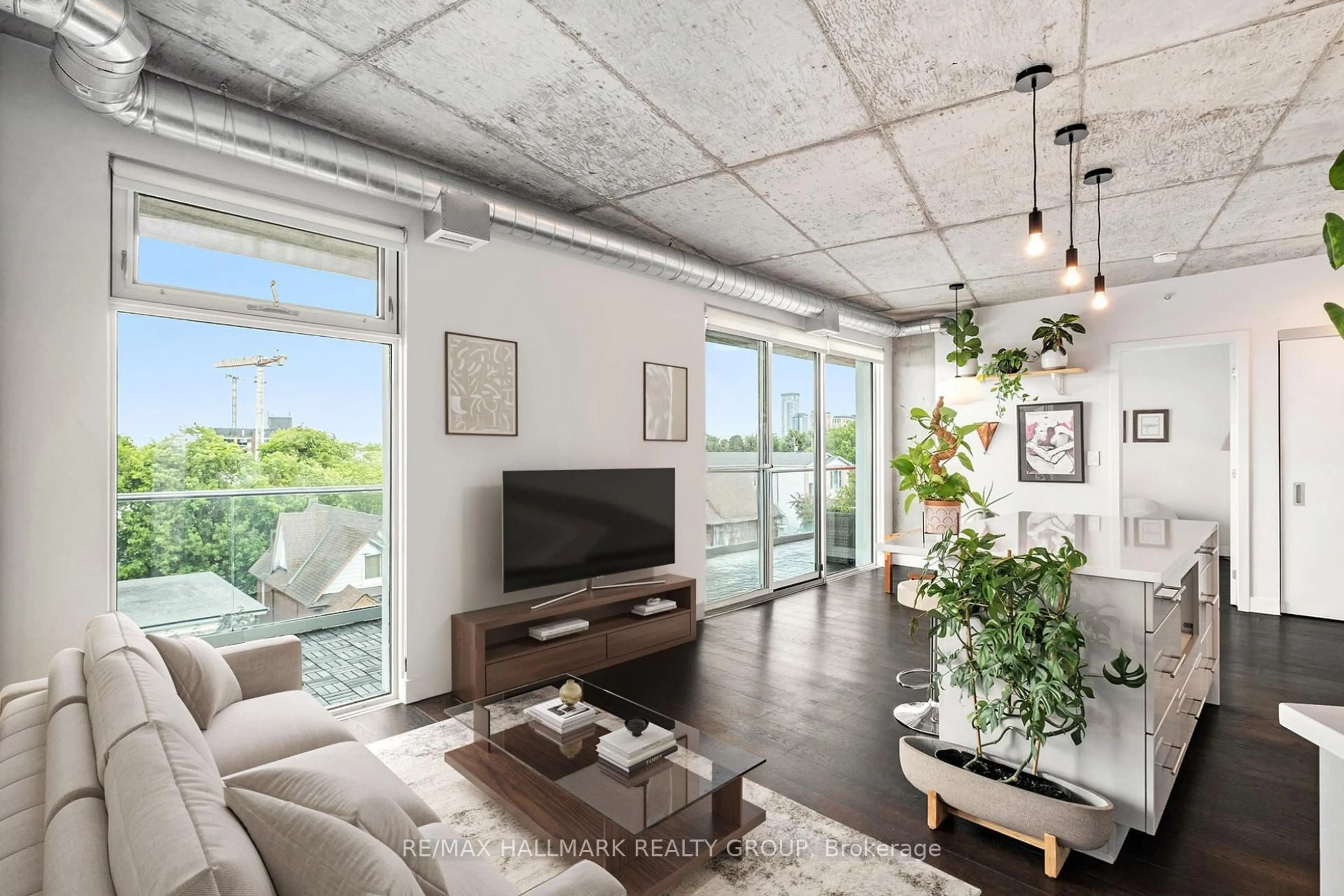 Living room with furniture, cement floor for 1000 Wellington St #508, Ottawa Ontario K1Y 2X9