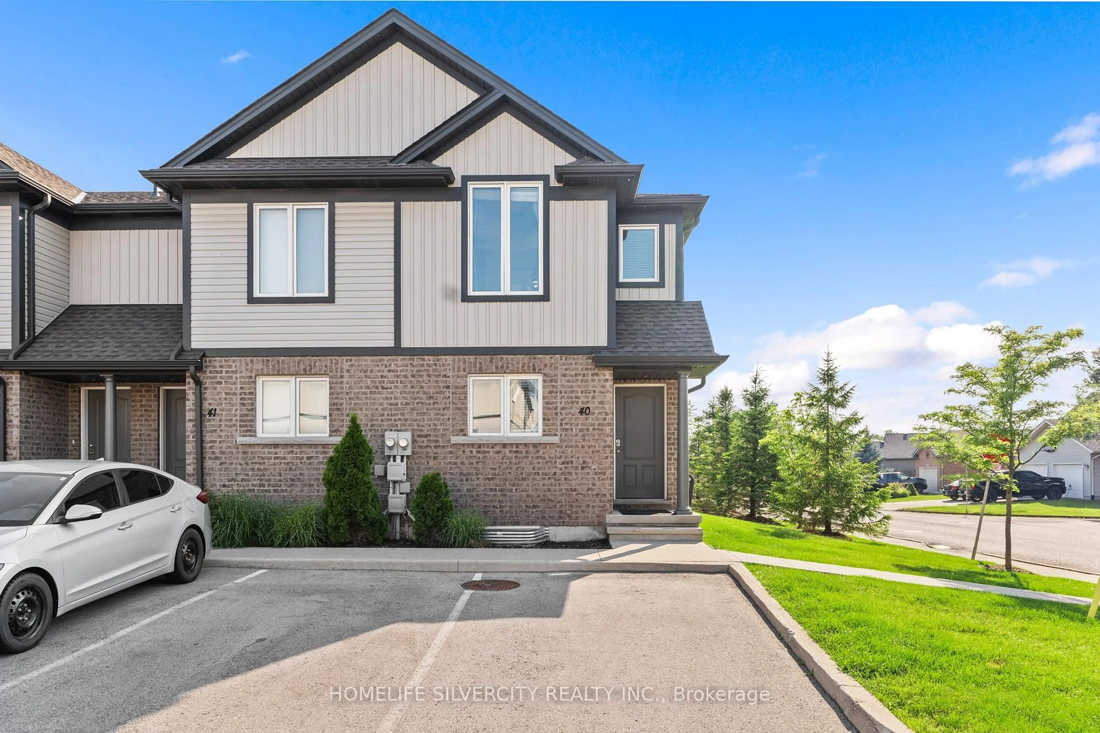 Home with brick exterior material, street for 7768 Ascot Circ #40, Niagara Falls Ontario L2H 3P9