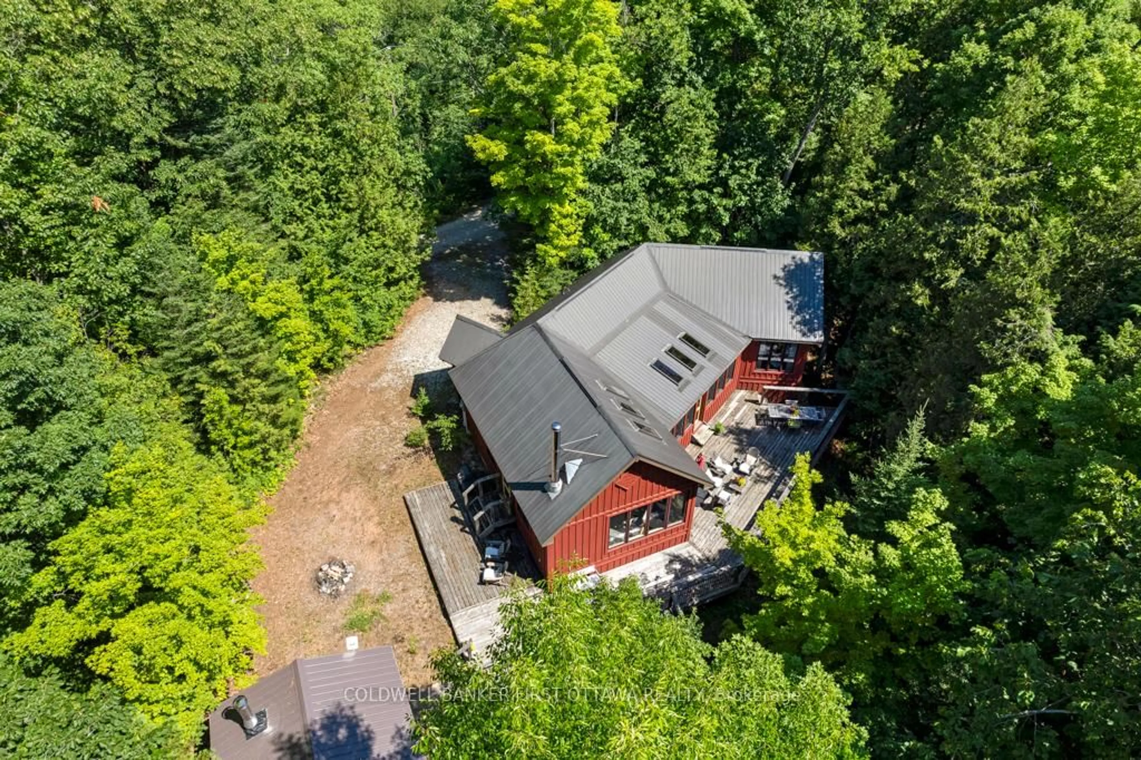 A pic from outside/outdoor area/front of a property/back of a property/a pic from drone, forest/trees view for 1245 North Shore Estates Lane, Ompah Ontario K0H 2J0