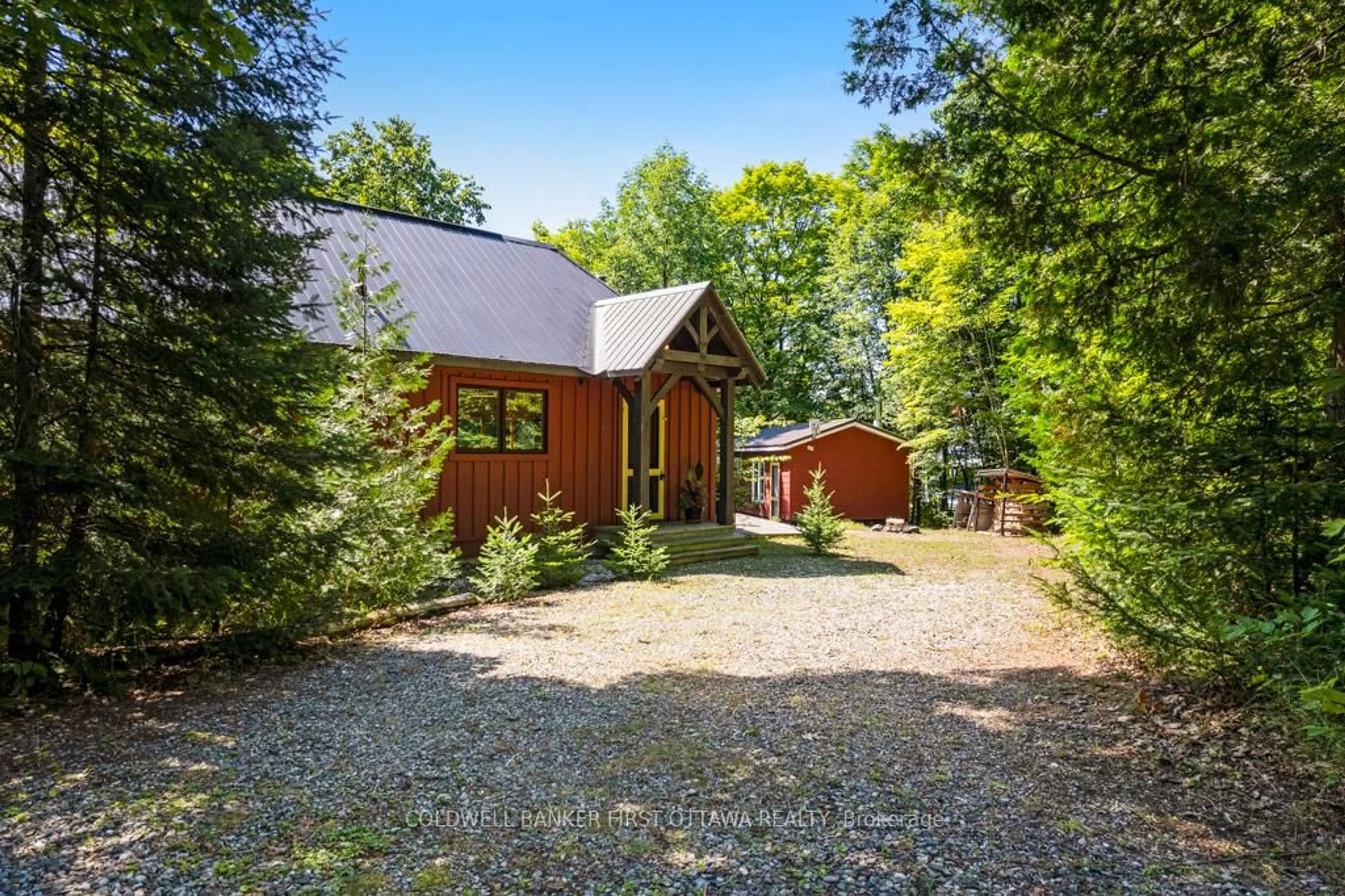 A pic from outside/outdoor area/front of a property/back of a property/a pic from drone, forest/trees view for 1245 North Shore Estates Lane, Ompah Ontario K0H 2J0