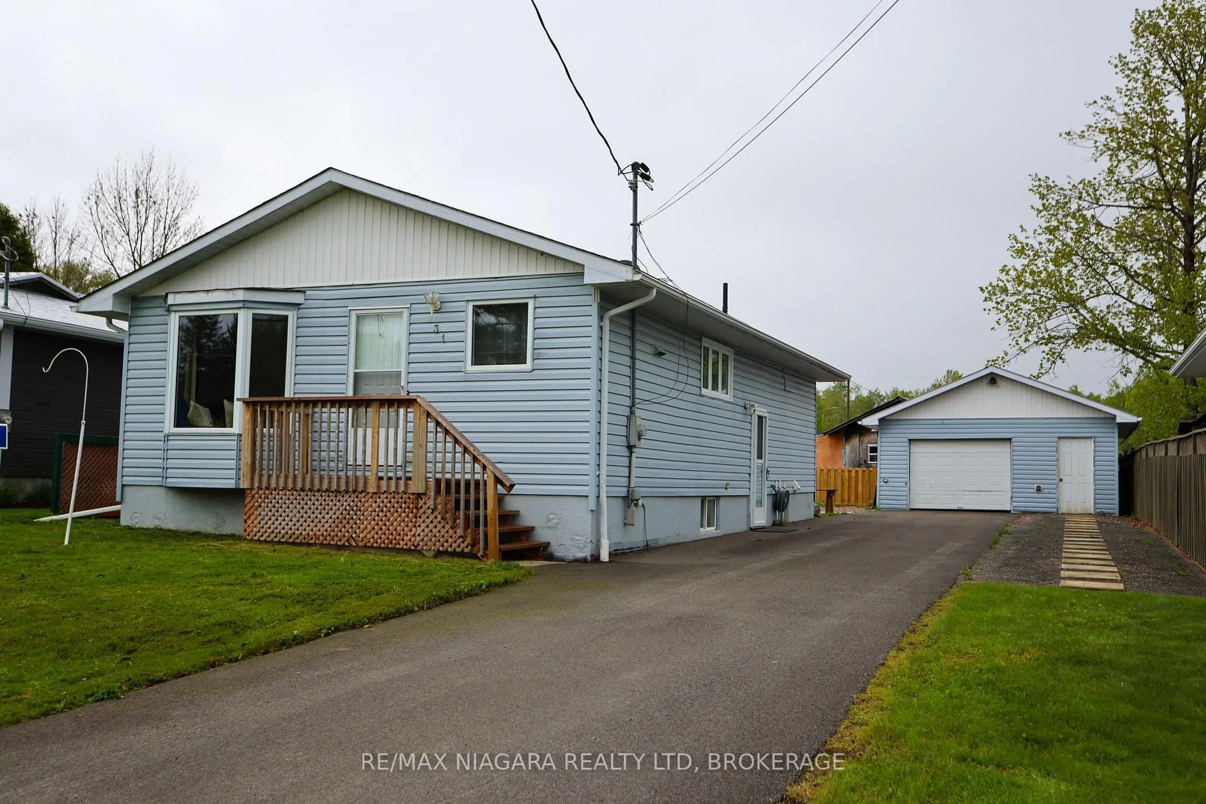 Home with vinyl exterior material, street for 31 Spruce Dr, Temagami Ontario P0H 2H0