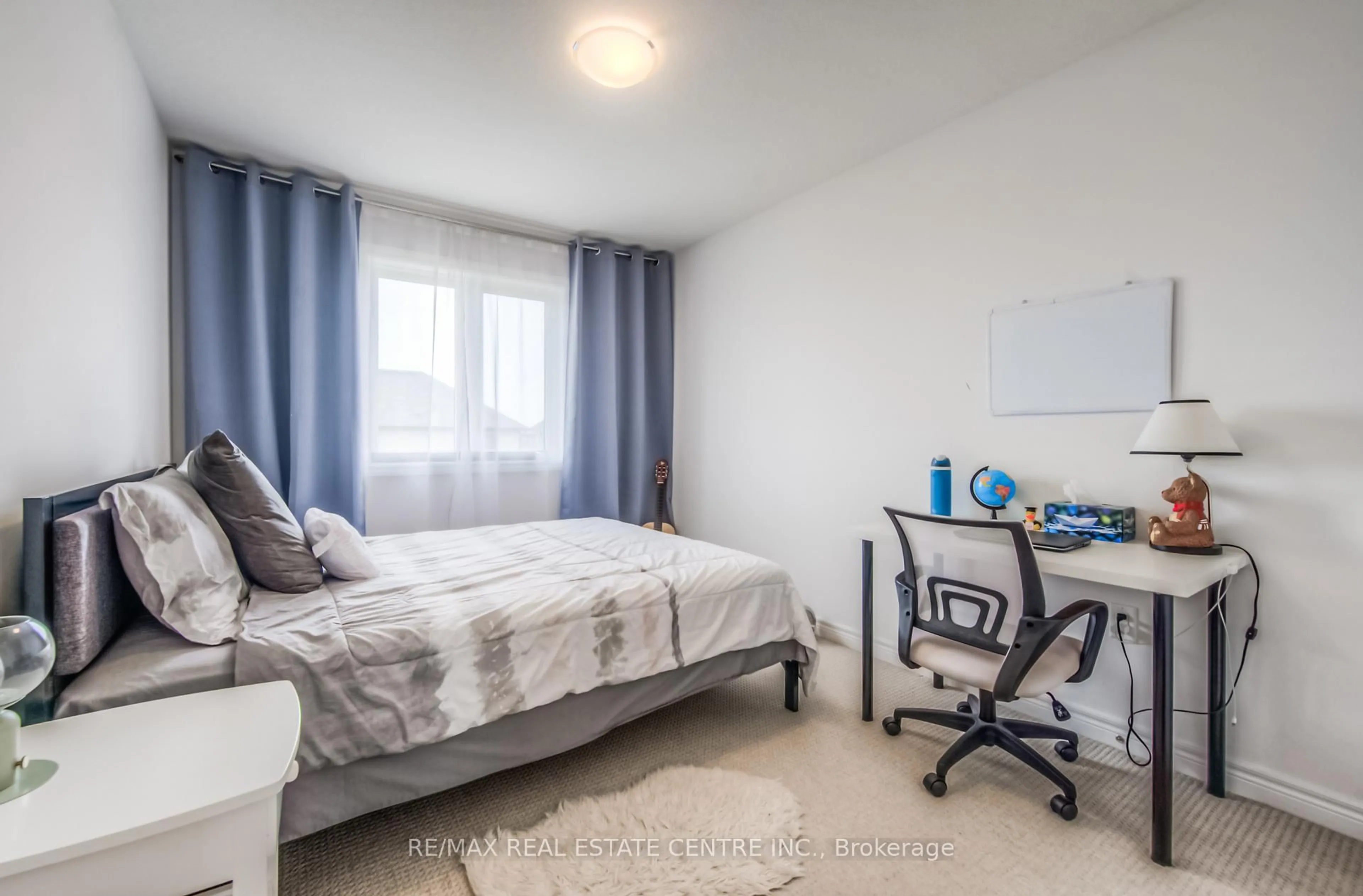 Bedroom with bed, wood/laminate floor for 19 Baker Lane, Brant Ontario N3L 0K3