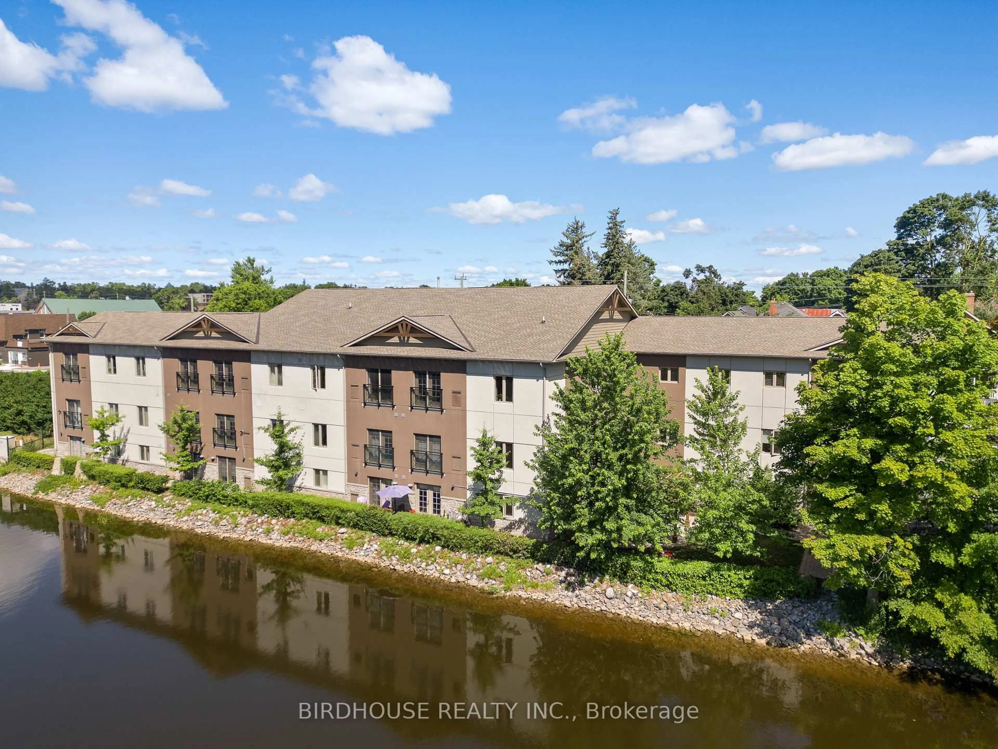 A pic from outside/outdoor area/front of a property/back of a property/a pic from drone, water/lake/river/ocean view for 25 King St #102, Kawartha Lakes Ontario K9V 1C4