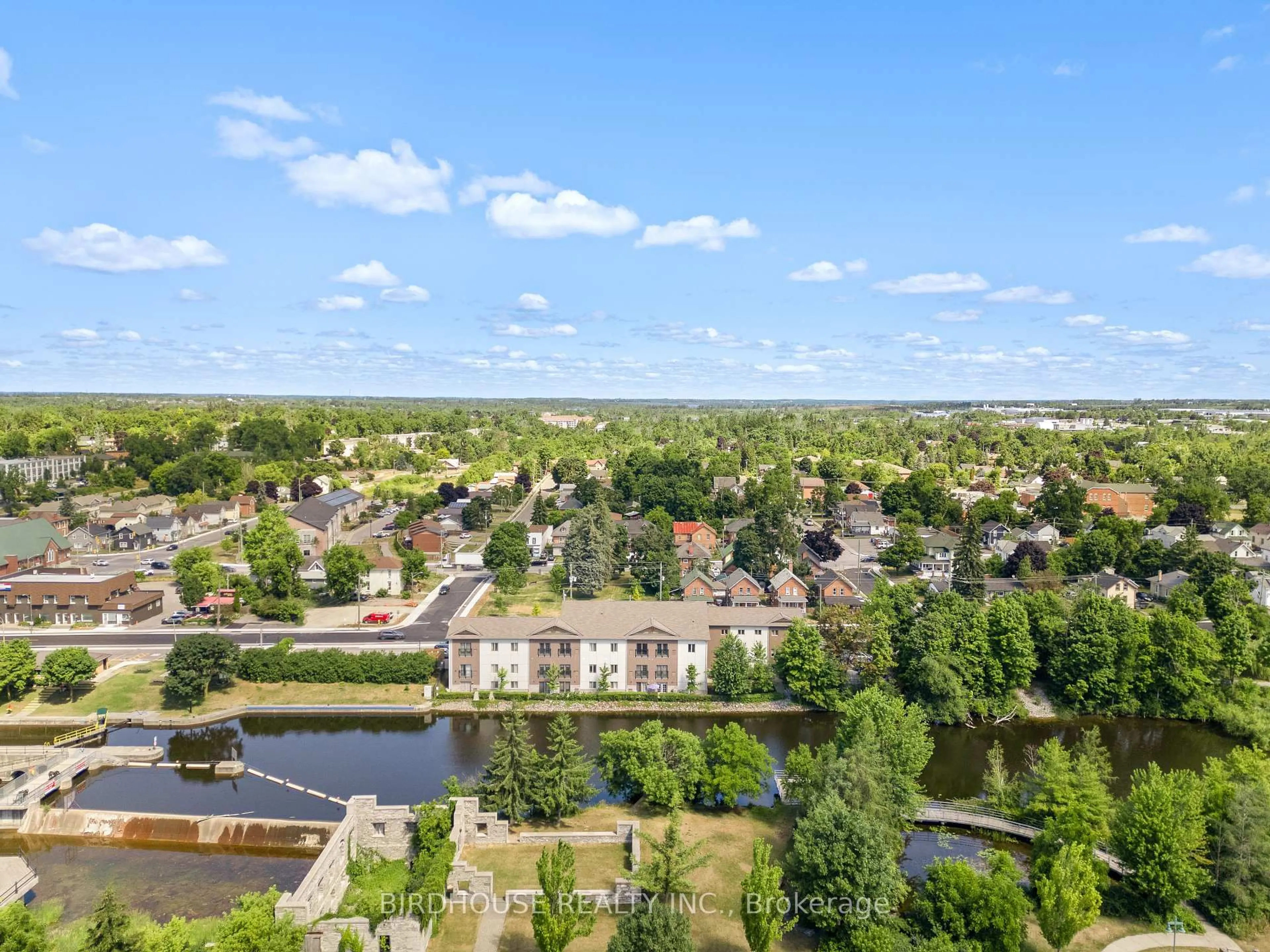 A pic from outside/outdoor area/front of a property/back of a property/a pic from drone, water/lake/river/ocean view for 25 King St #102, Kawartha Lakes Ontario K9V 1C4