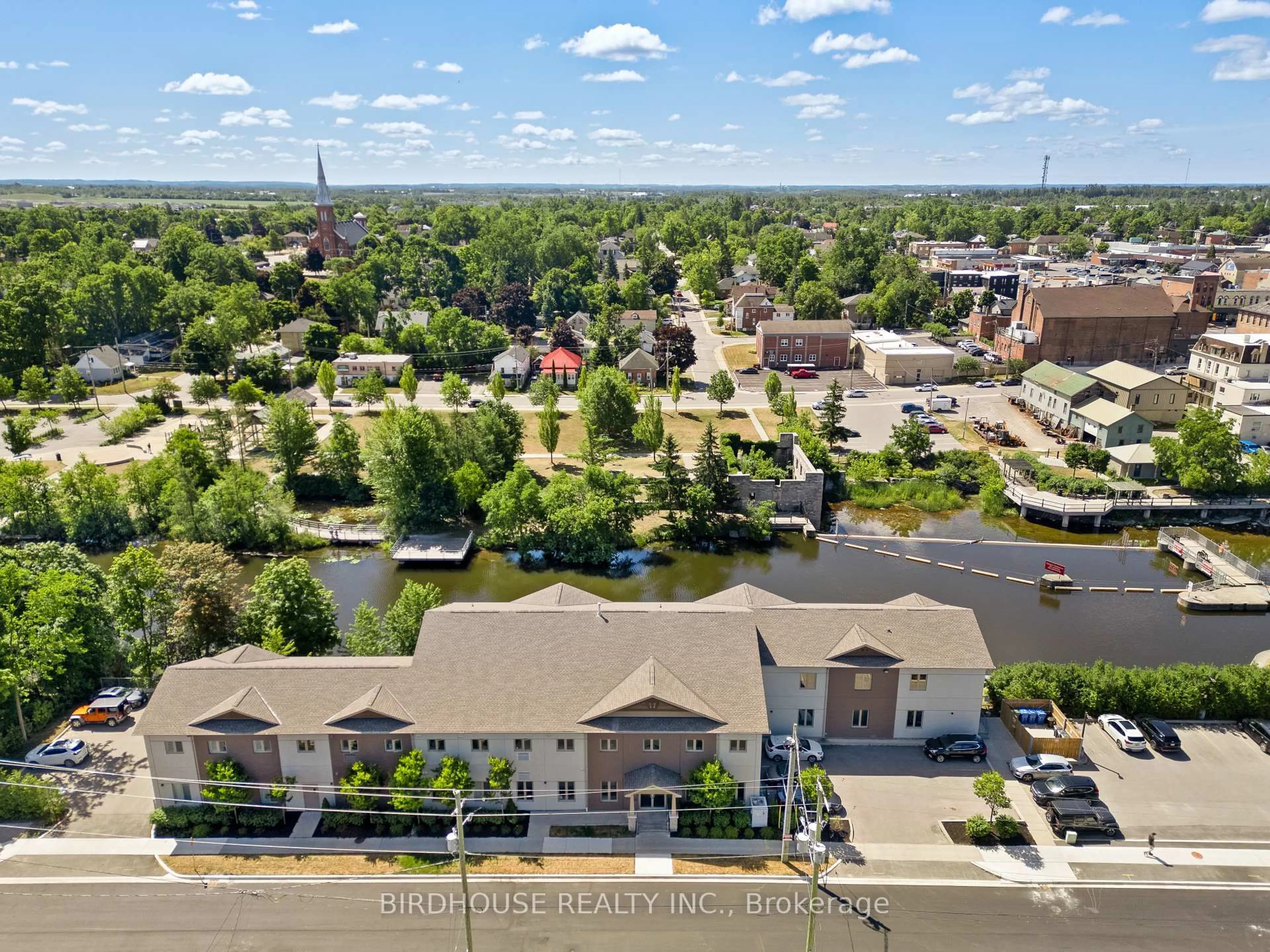 A pic from outside/outdoor area/front of a property/back of a property/a pic from drone, unknown for 25 King St #102, Kawartha Lakes Ontario K9V 1C4