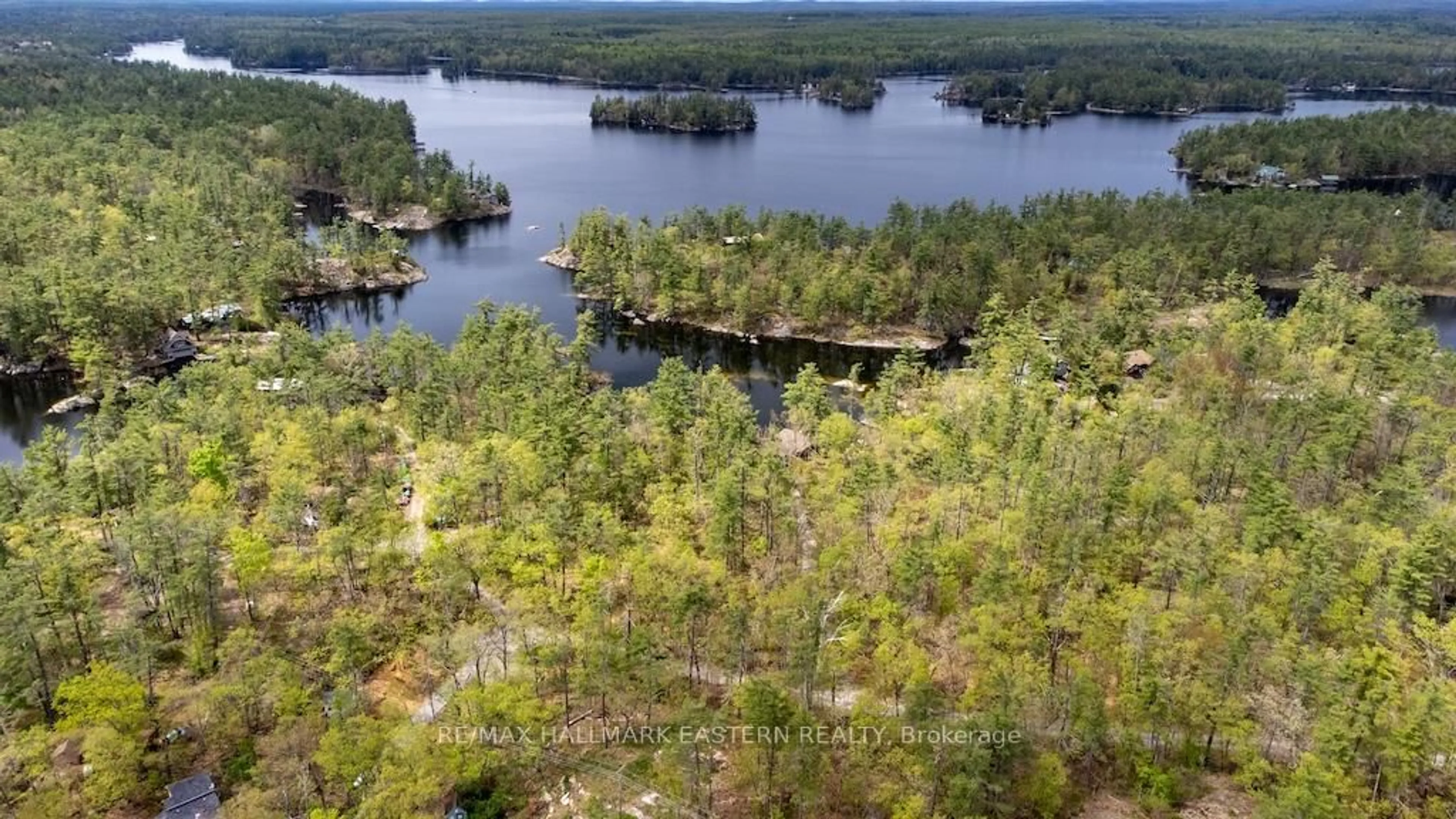 A pic from outside/outdoor area/front of a property/back of a property/a pic from drone, water/lake/river/ocean view for 3566 Rock Crossway Lane, Selwyn Ontario K0L 2H0
