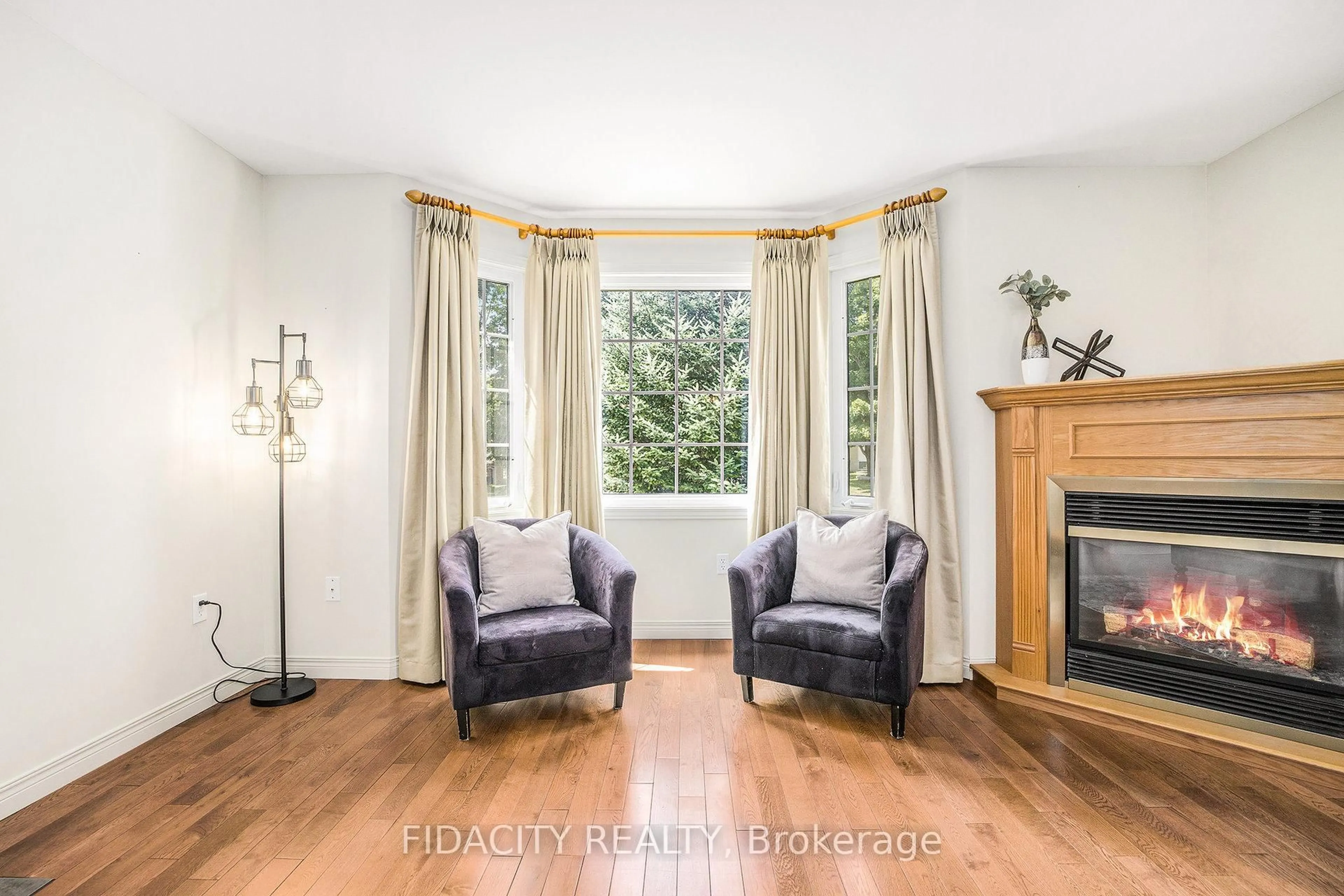 Living room with furniture, wood/laminate floor for 616 Clothier St, North Grenville Ontario K0G 1J0