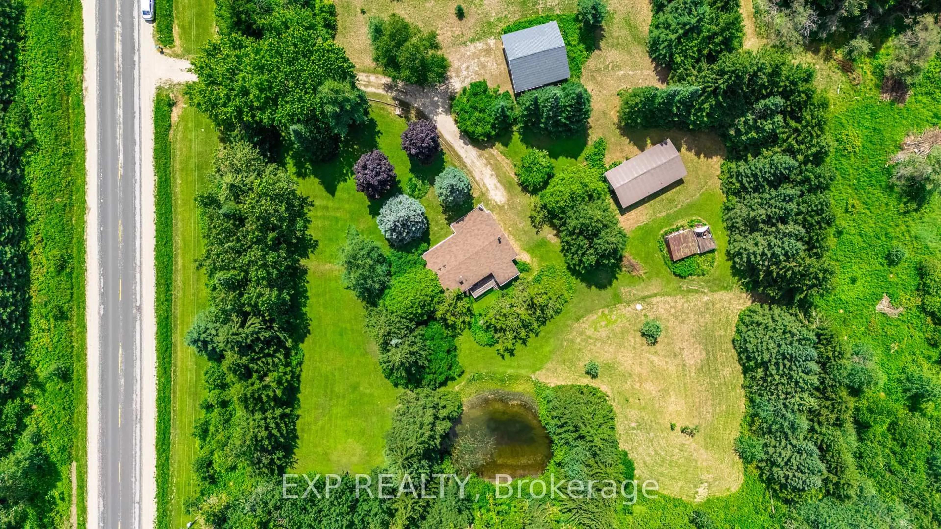 A pic from outside/outdoor area/front of a property/back of a property/a pic from drone, water/lake/river/ocean view for 111490 Grey County Road 14, Southgate Ontario N0G 1N0