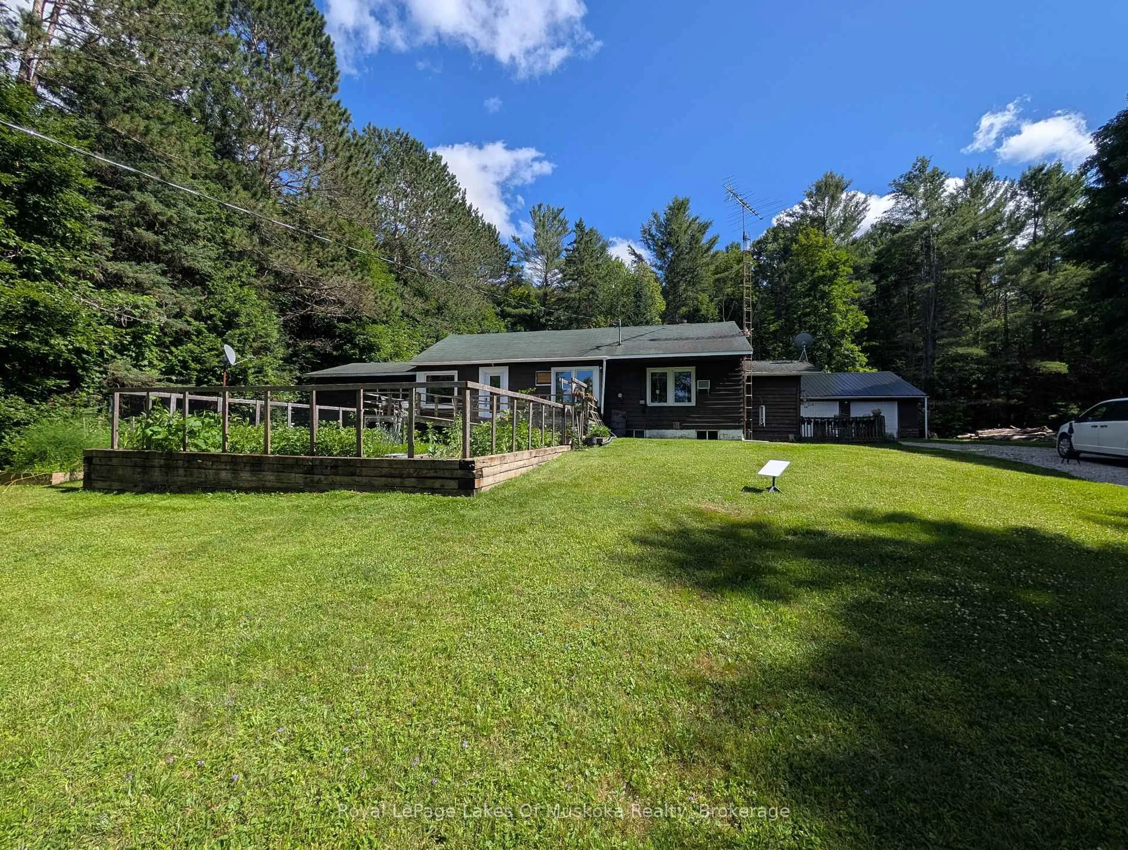 A pic from outside/outdoor area/front of a property/back of a property/a pic from drone, water/lake/river/ocean view for 785 518 Highway, Perry Ontario P0A 1J0