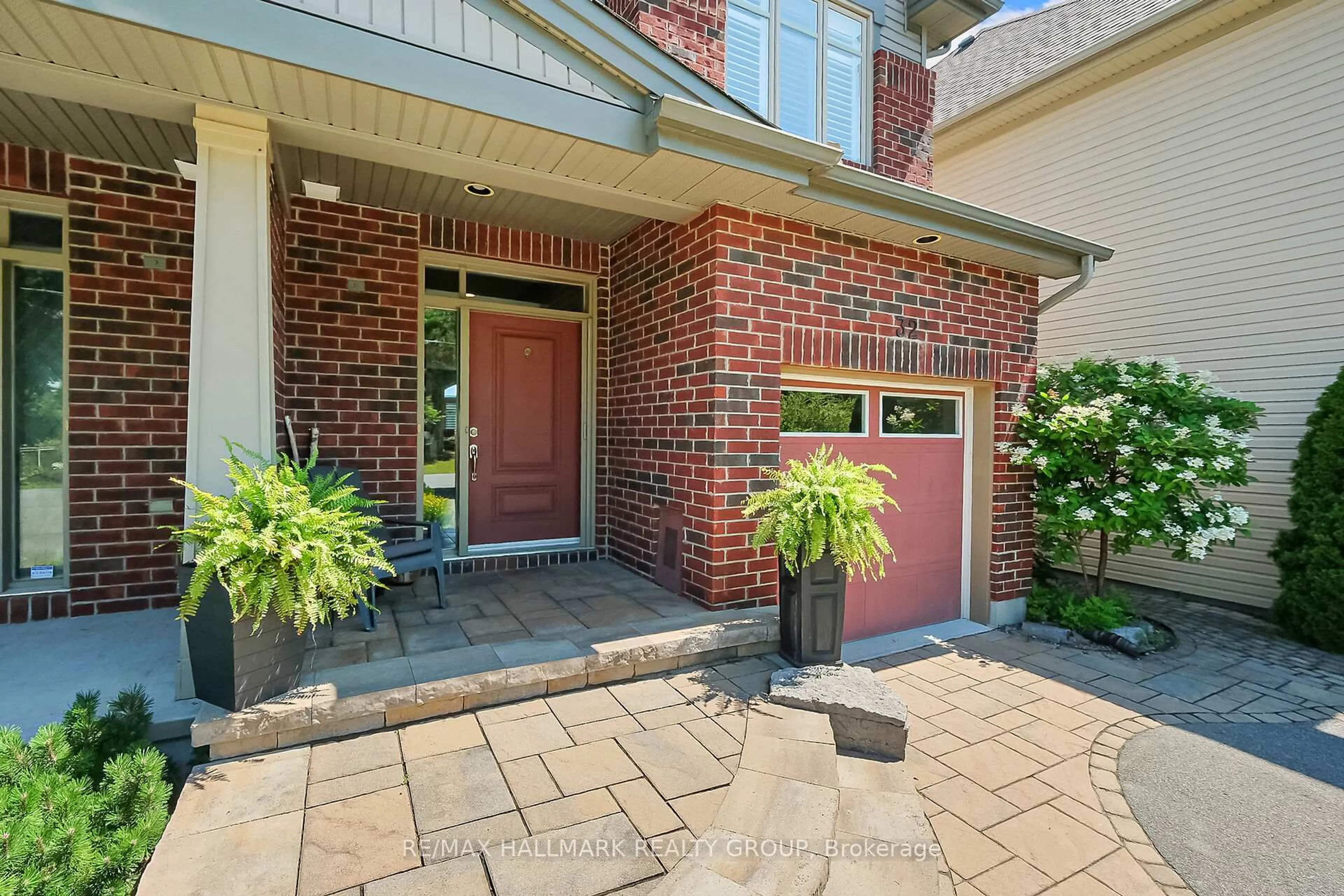 Home with brick exterior material, street for 32 McCooeye Lane, Ottawa Ontario K2S 1B9