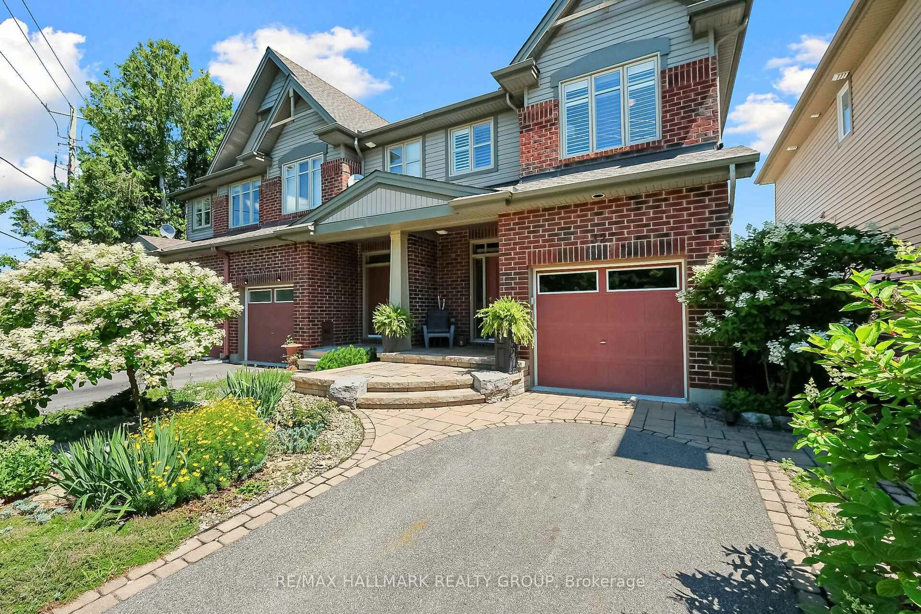 Home with brick exterior material, street for 32 McCooeye Lane, Ottawa Ontario K2S 1B9