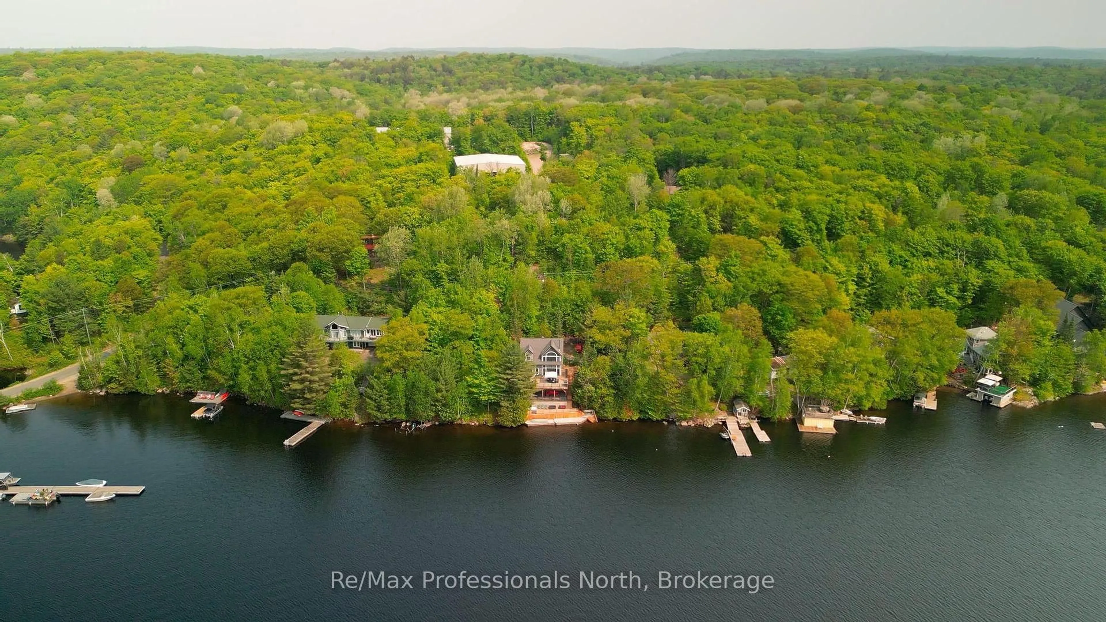 A pic from outside/outdoor area/front of a property/back of a property/a pic from drone, water/lake/river/ocean view for 1024 Albert Lane, Algonquin Highlands Ontario P0E 1E0