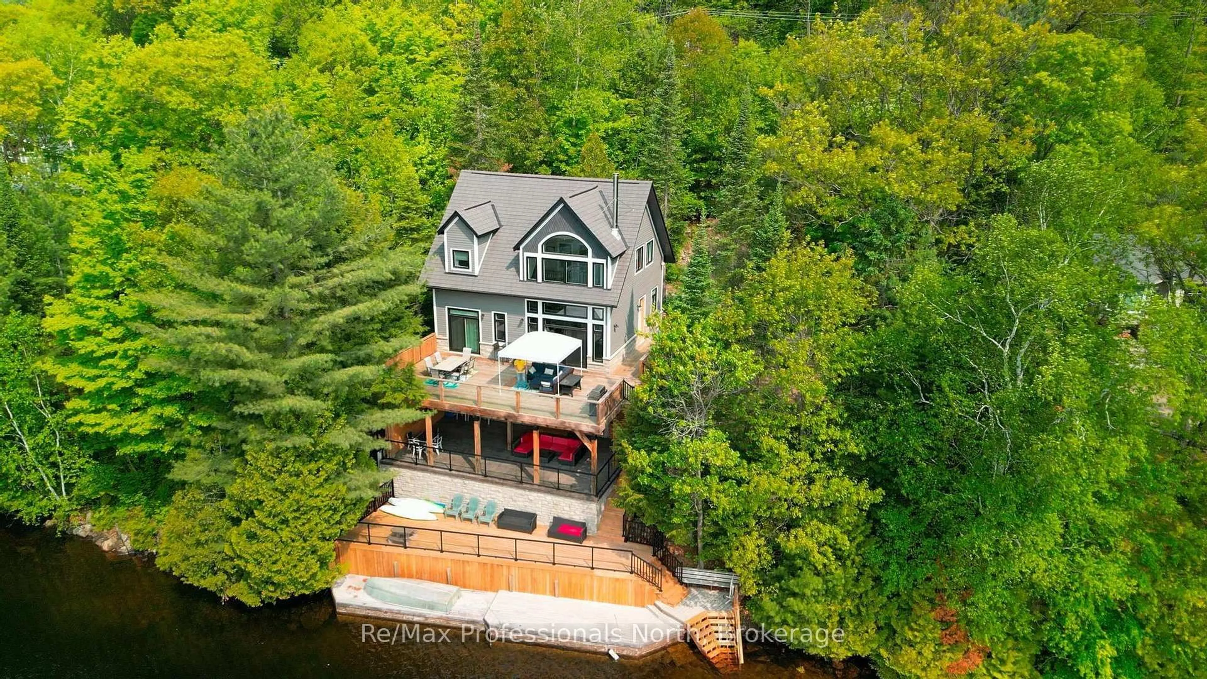 A pic from outside/outdoor area/front of a property/back of a property/a pic from drone, water/lake/river/ocean view for 1024 Albert Lane, Algonquin Highlands Ontario P0E 1E0