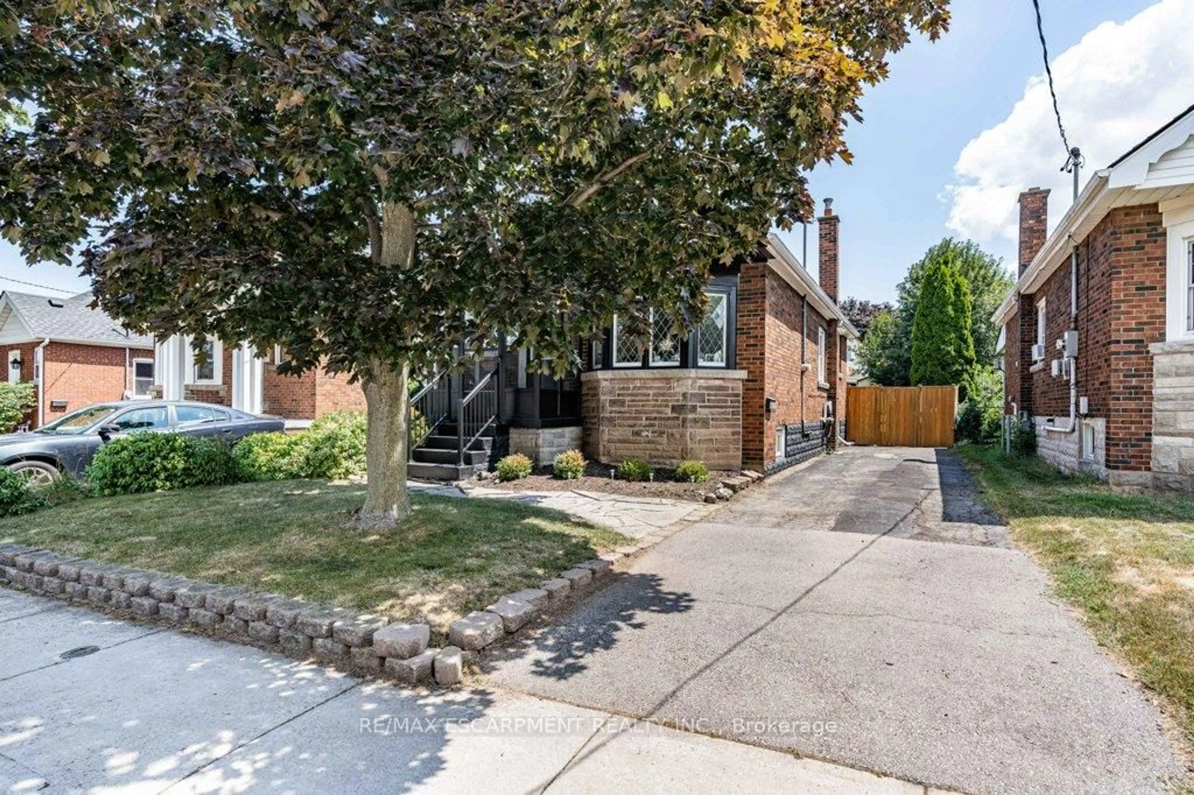 Home with brick exterior material, street for 103 Cameron Ave, Hamilton Ontario L8K 2X5