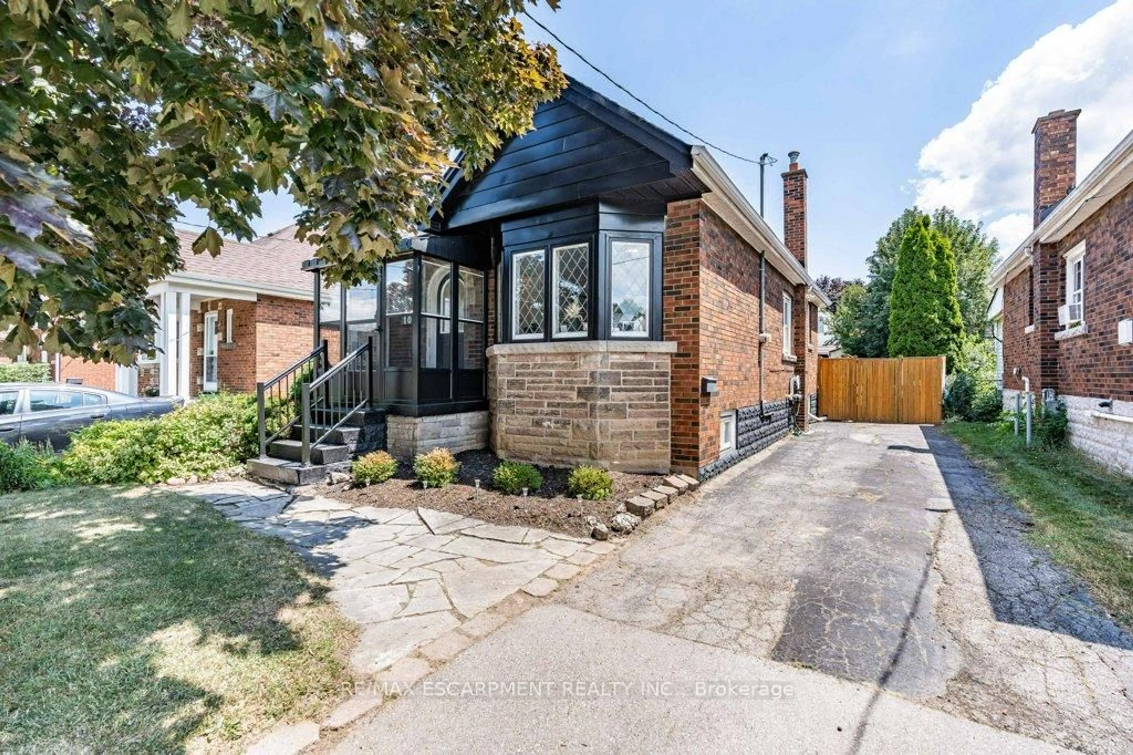 Home with brick exterior material, street for 103 Cameron Ave, Hamilton Ontario L8K 2X5