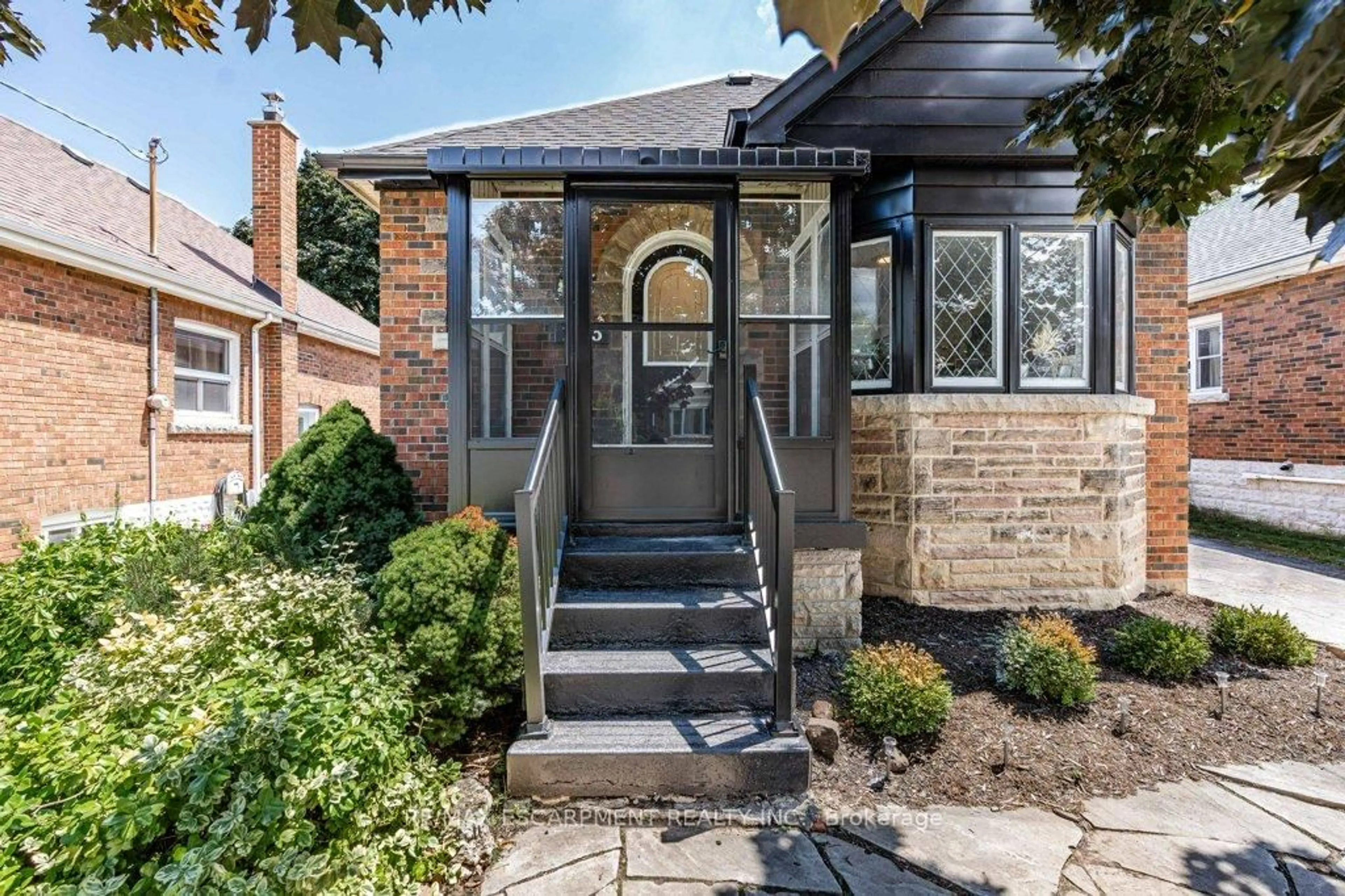 Home with brick exterior material, street for 103 Cameron Ave, Hamilton Ontario L8K 2X5