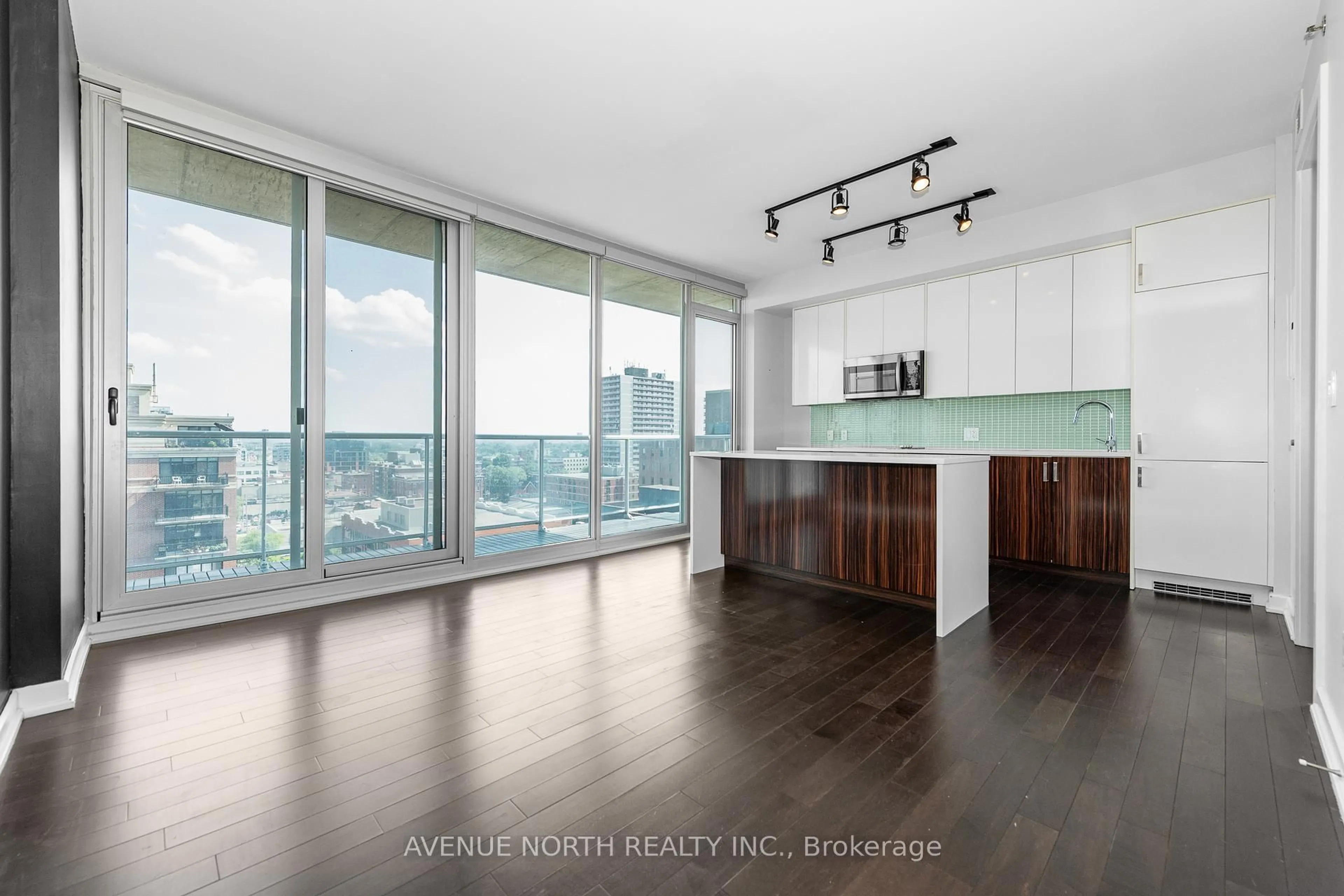 Open concept kitchen, wood/laminate floor for 300 Lisgar St #1109, Ottawa Ontario K2P 0E2