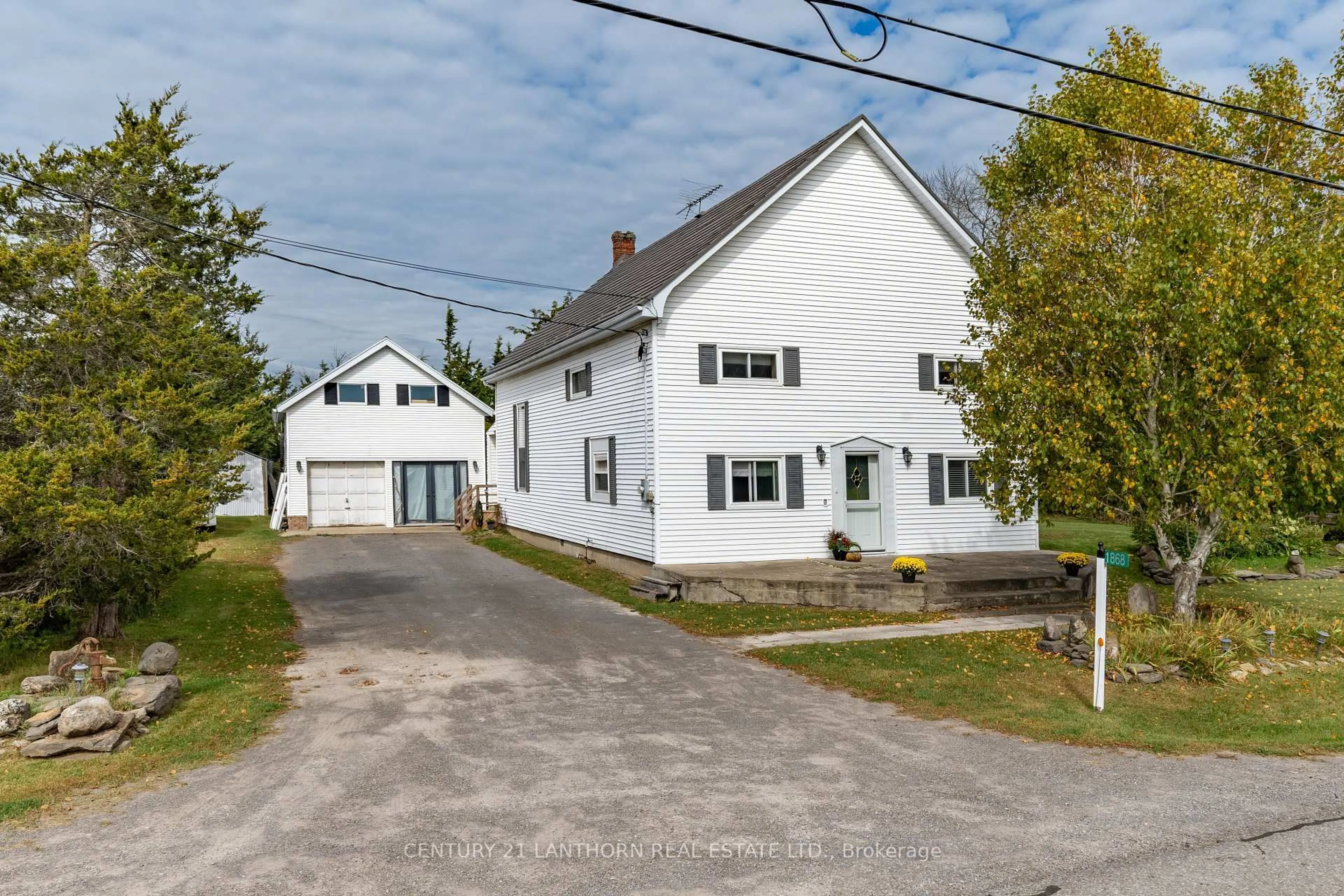 A pic from outside/outdoor area/front of a property/back of a property/a pic from drone, street for 1868 County Road 14 Rd, Prince Edward County Ontario K0K 1A0