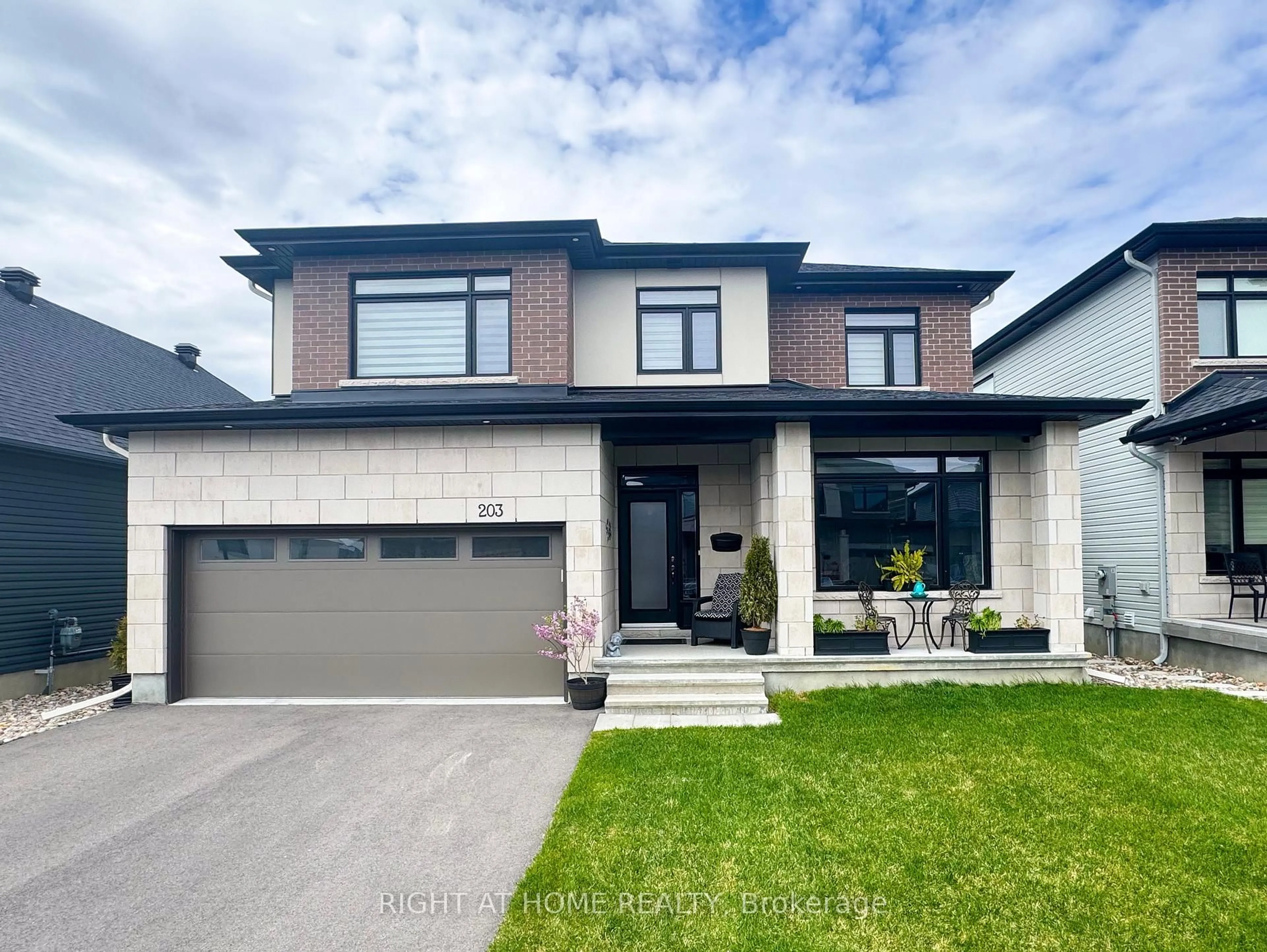 Home with brick exterior material, street for 203 Osterley Way, Ottawa Ontario K2S 2N6