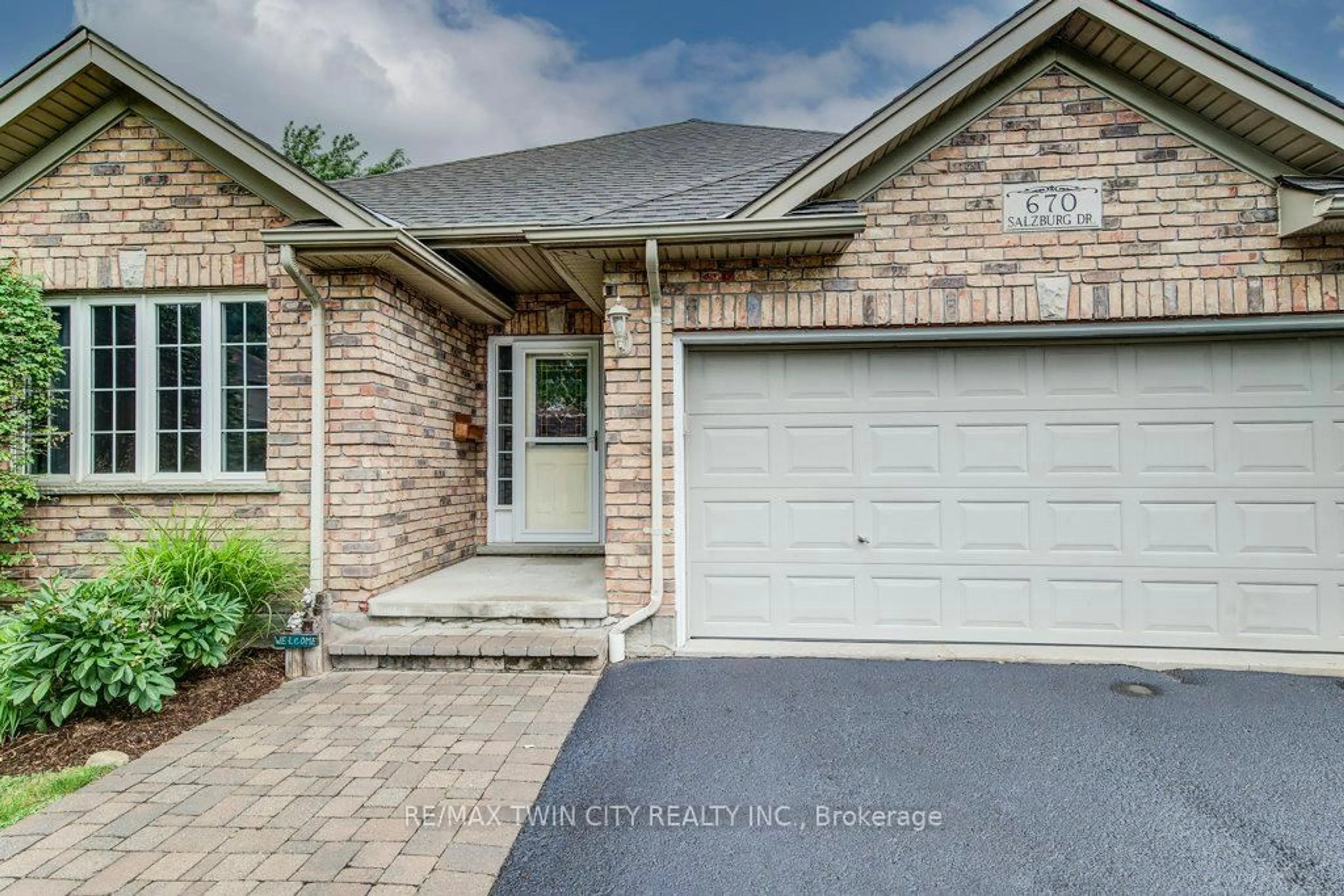 Home with brick exterior material, street for 670 Salzburg Dr, Waterloo Ontario N2V 2N8
