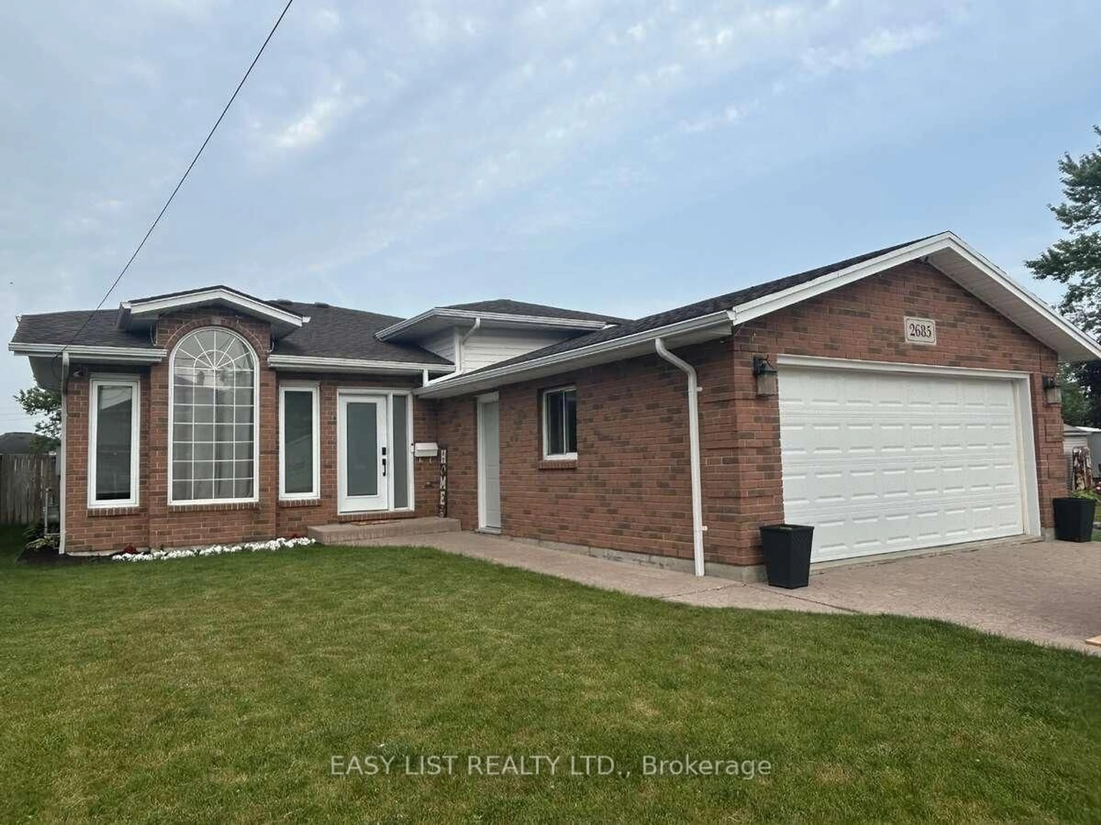 Home with brick exterior material, street for 2685 Tourangeau Rd, Windsor Ontario N8W 5M2