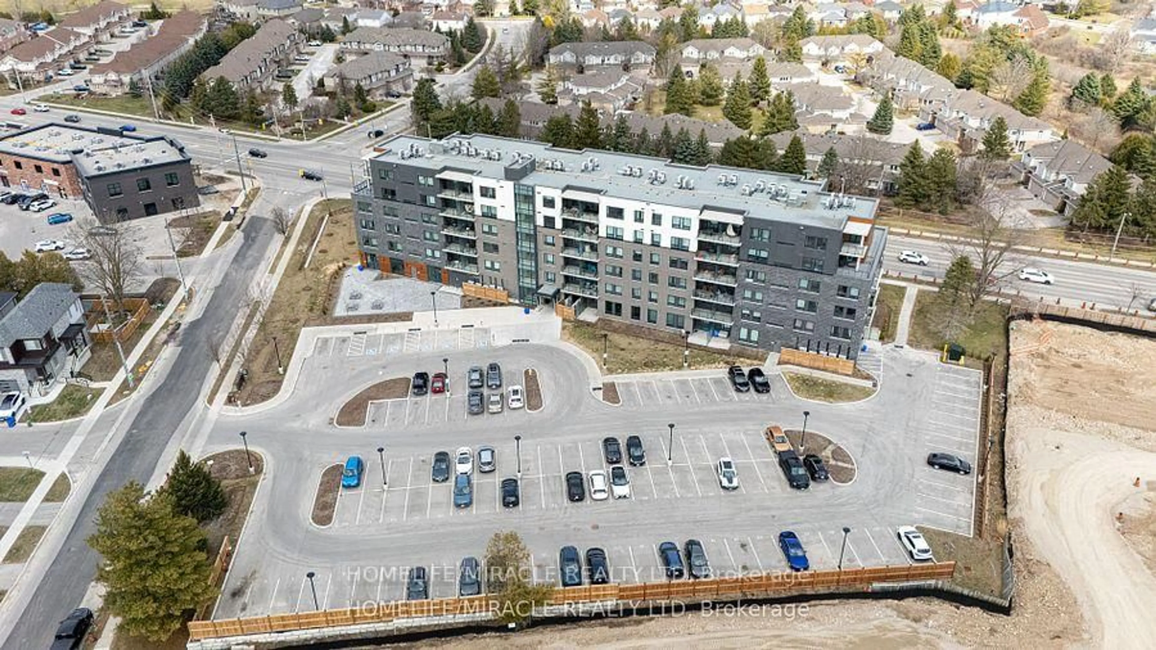 A pic from outside/outdoor area/front of a property/back of a property/a pic from drone, building for 26 Lowes Rd #402, Guelph Ontario N1G 4X2