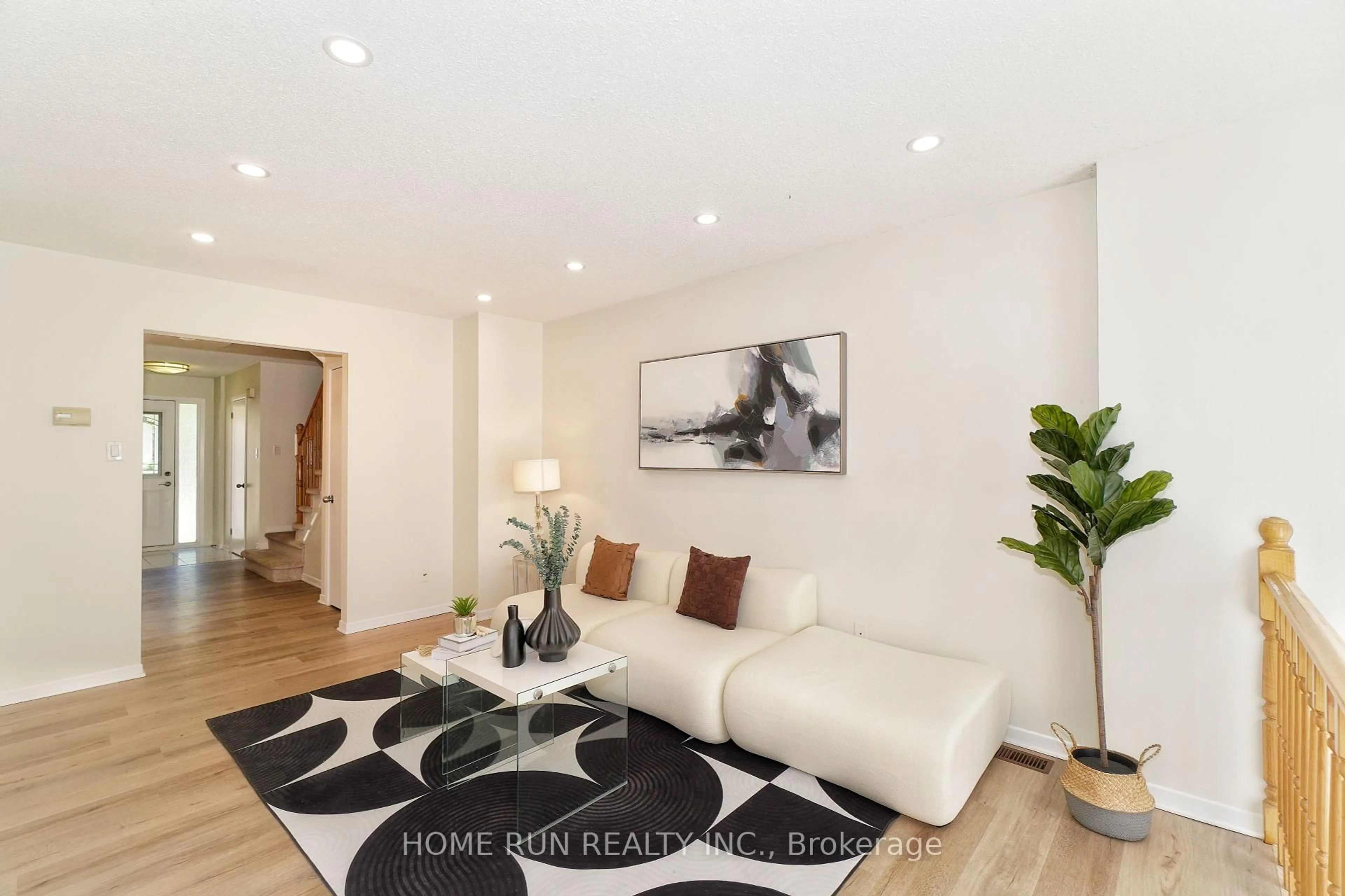 Living room with furniture, wood/laminate floor for 112 Cedarock Dr, Ottawa Ontario K2M 2H5
