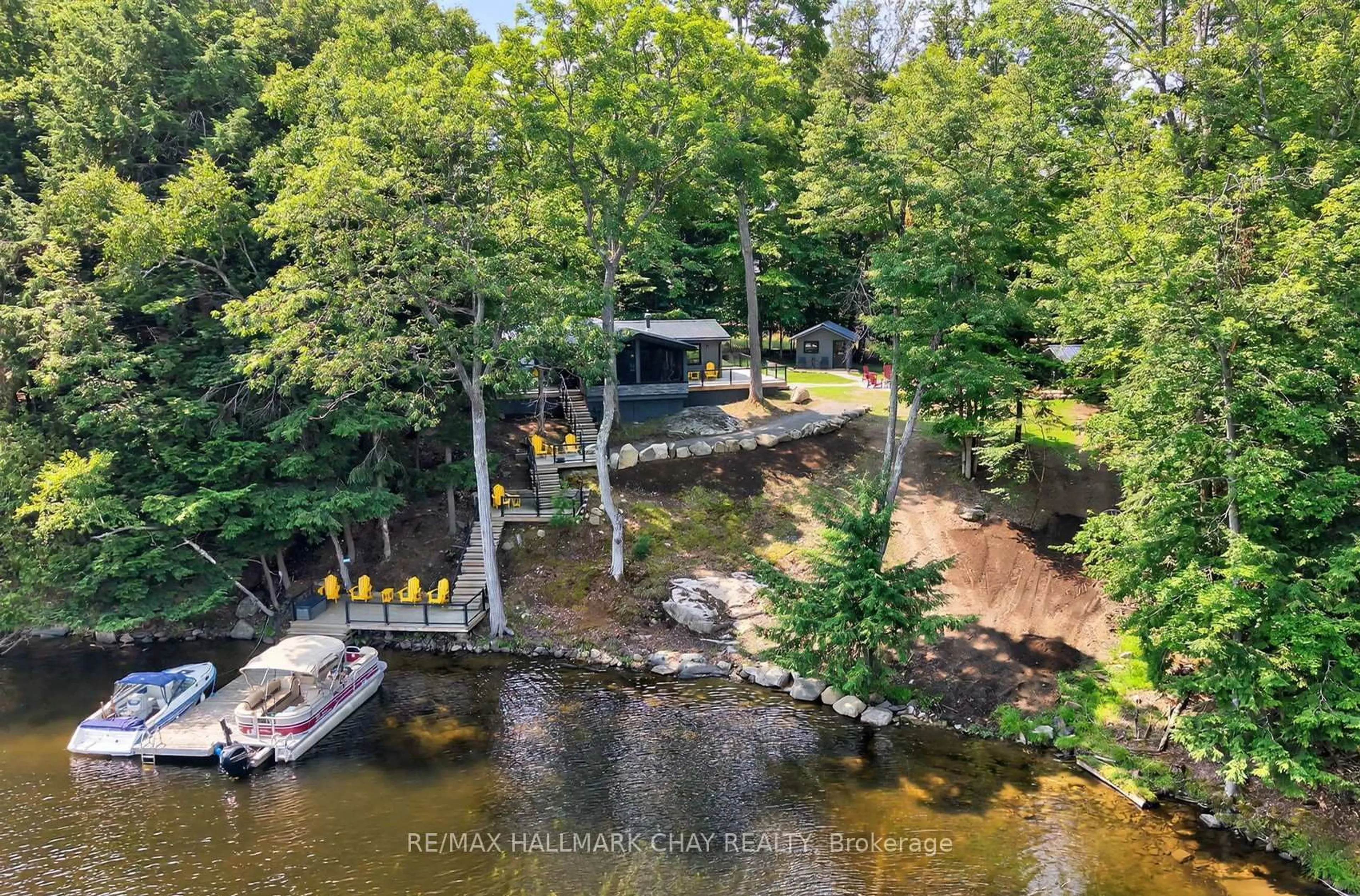 A pic from outside/outdoor area/front of a property/back of a property/a pic from drone, water/lake/river/ocean view for 1054 Eilean Gowan Island, Bracebridge Ontario P1L 1R6