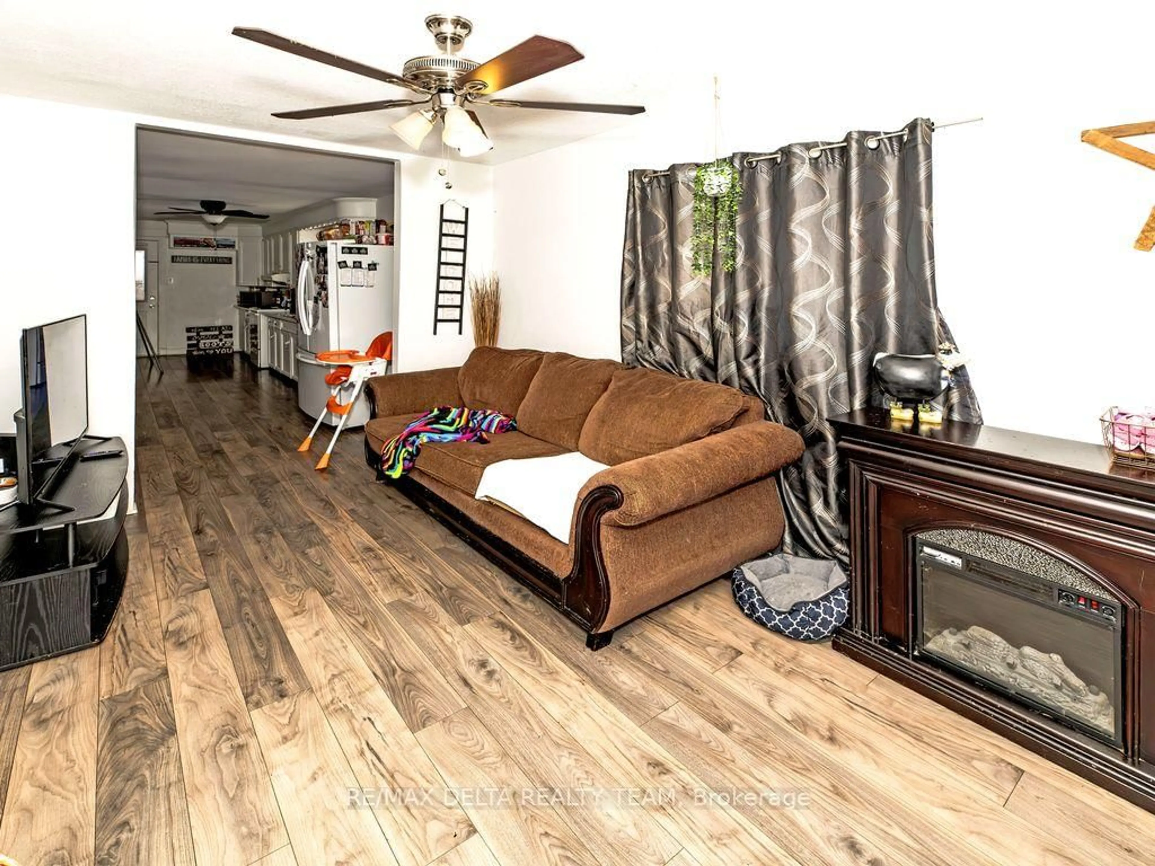 Living room with furniture, wood/laminate floor for 212 Mc Connell Ave, Cornwall Ontario K6H 4L3