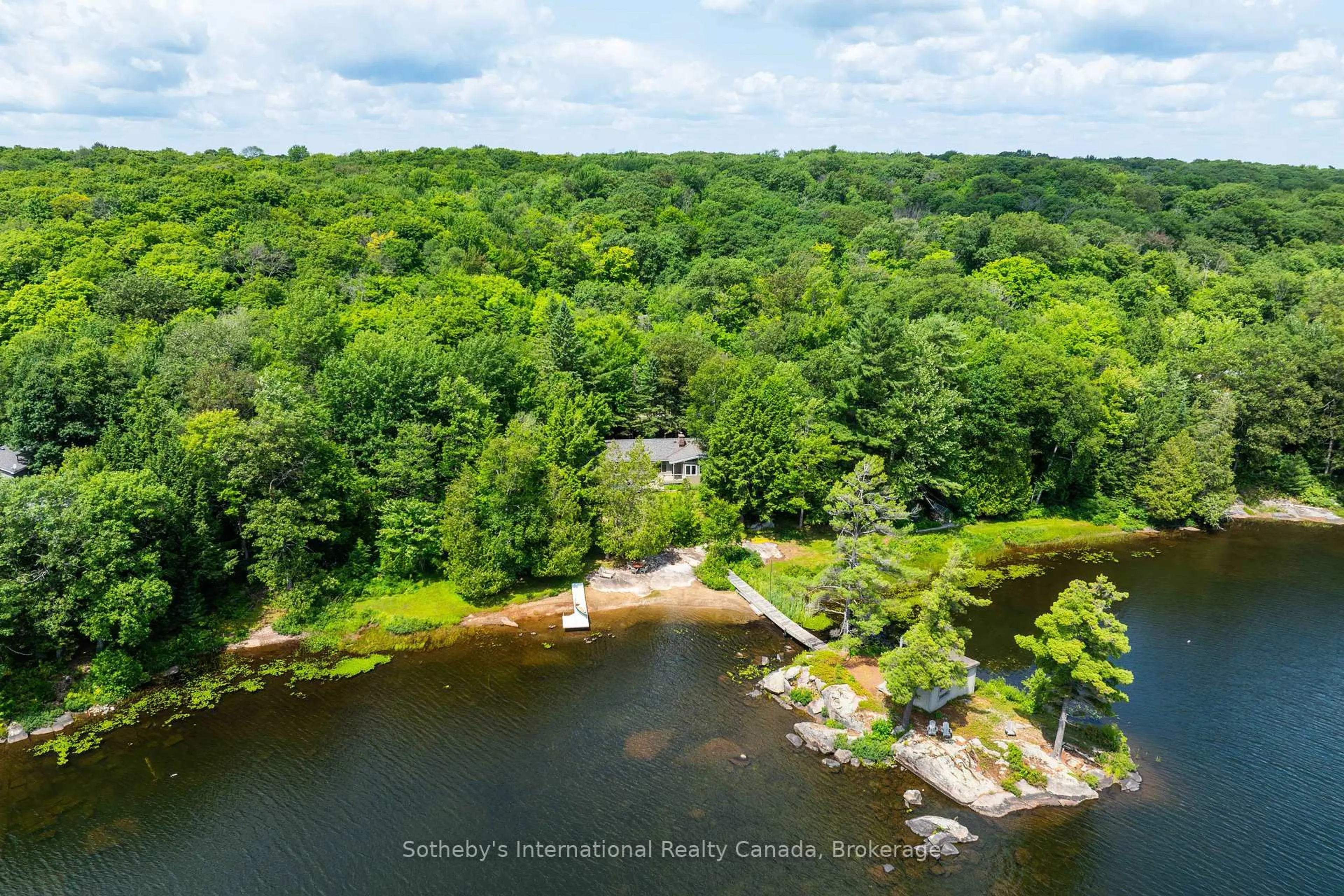 A pic from outside/outdoor area/front of a property/back of a property/a pic from drone, water/lake/river/ocean view for 1059 Tooke Lake Rd, Lake of Bays Ontario P0B 1A0