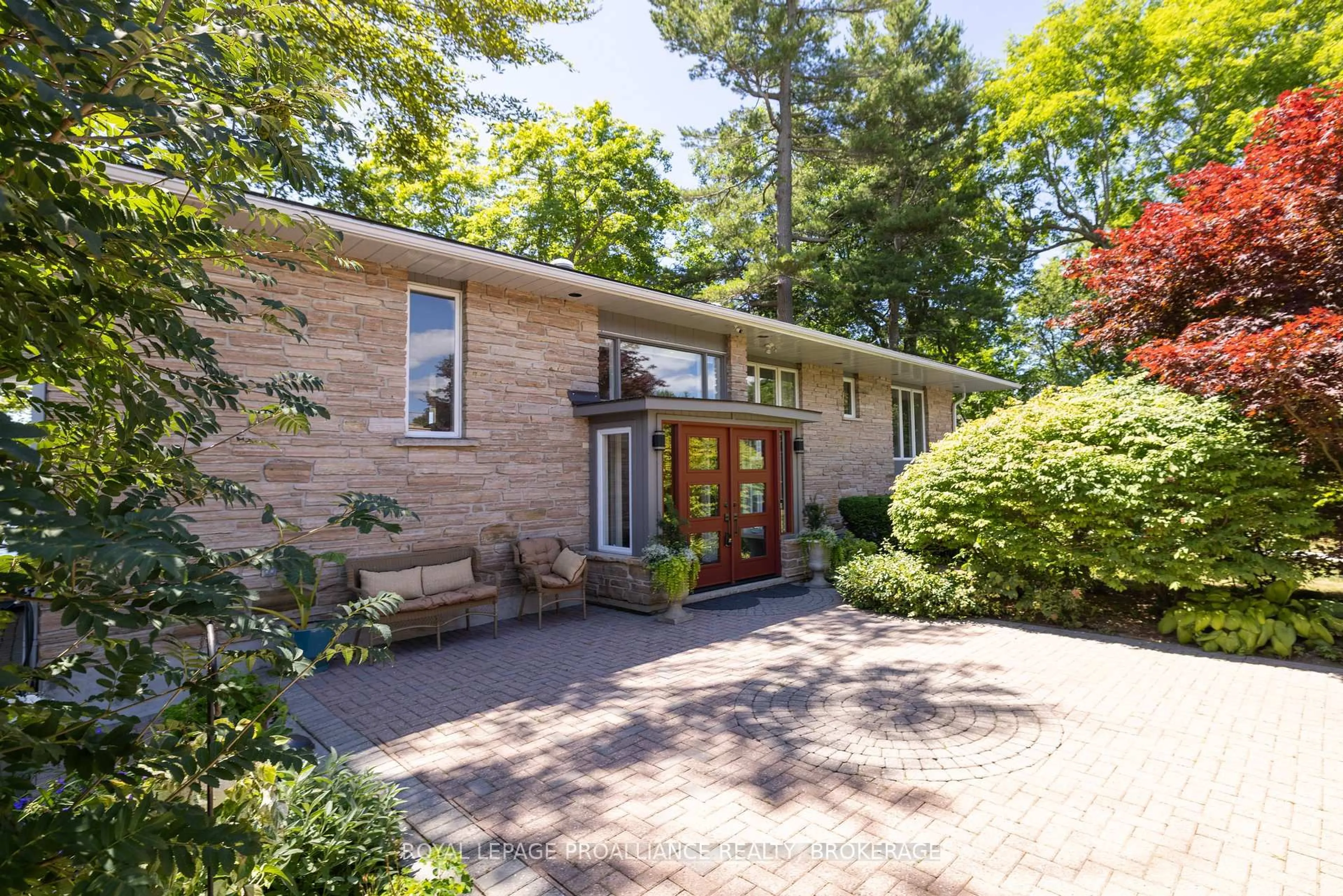 Home with brick exterior material, street for 8 Lakeshore Blvd, Kingston Ontario K7M 4J6
