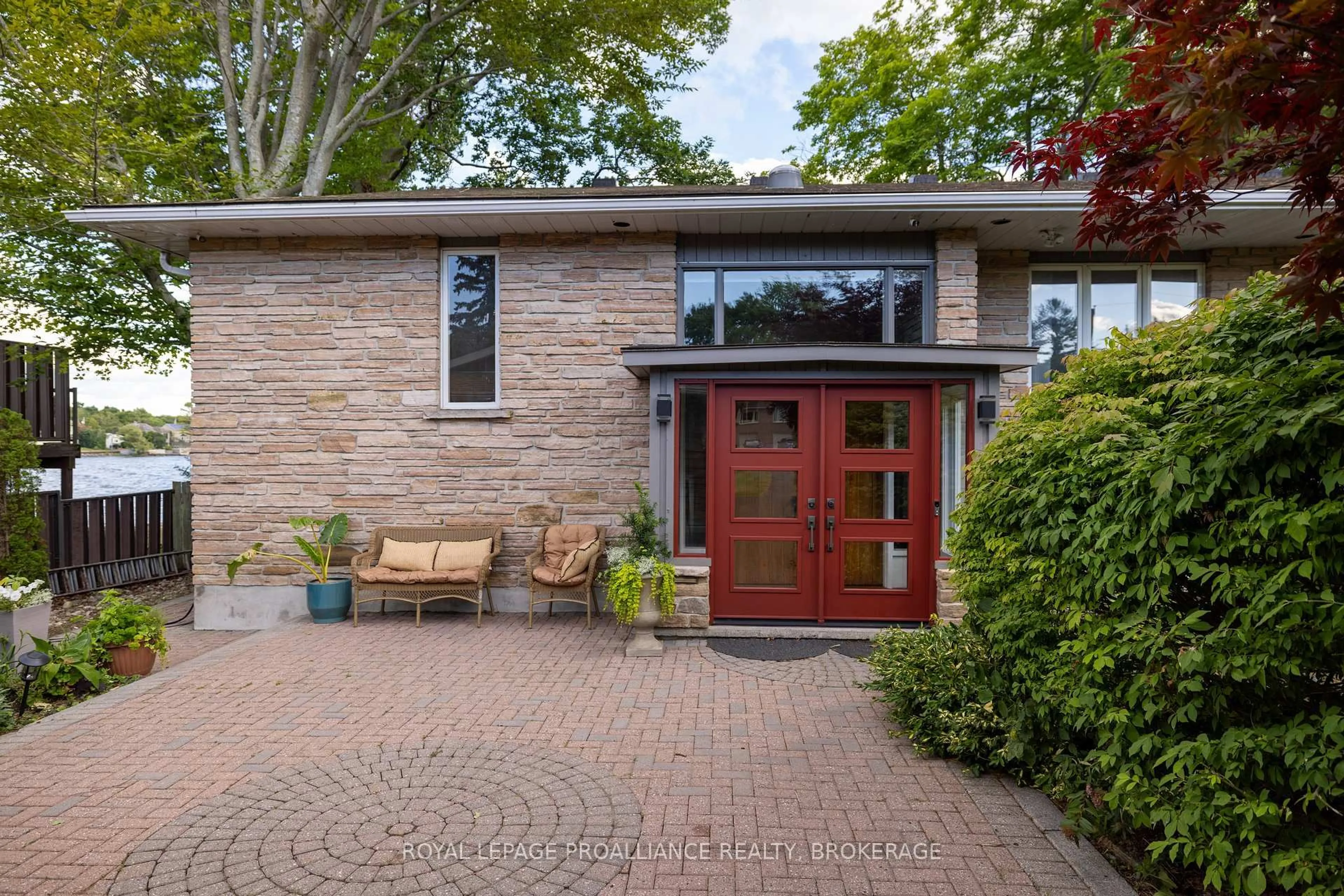 Home with brick exterior material, street for 8 Lakeshore Blvd, Kingston Ontario K7M 4J6