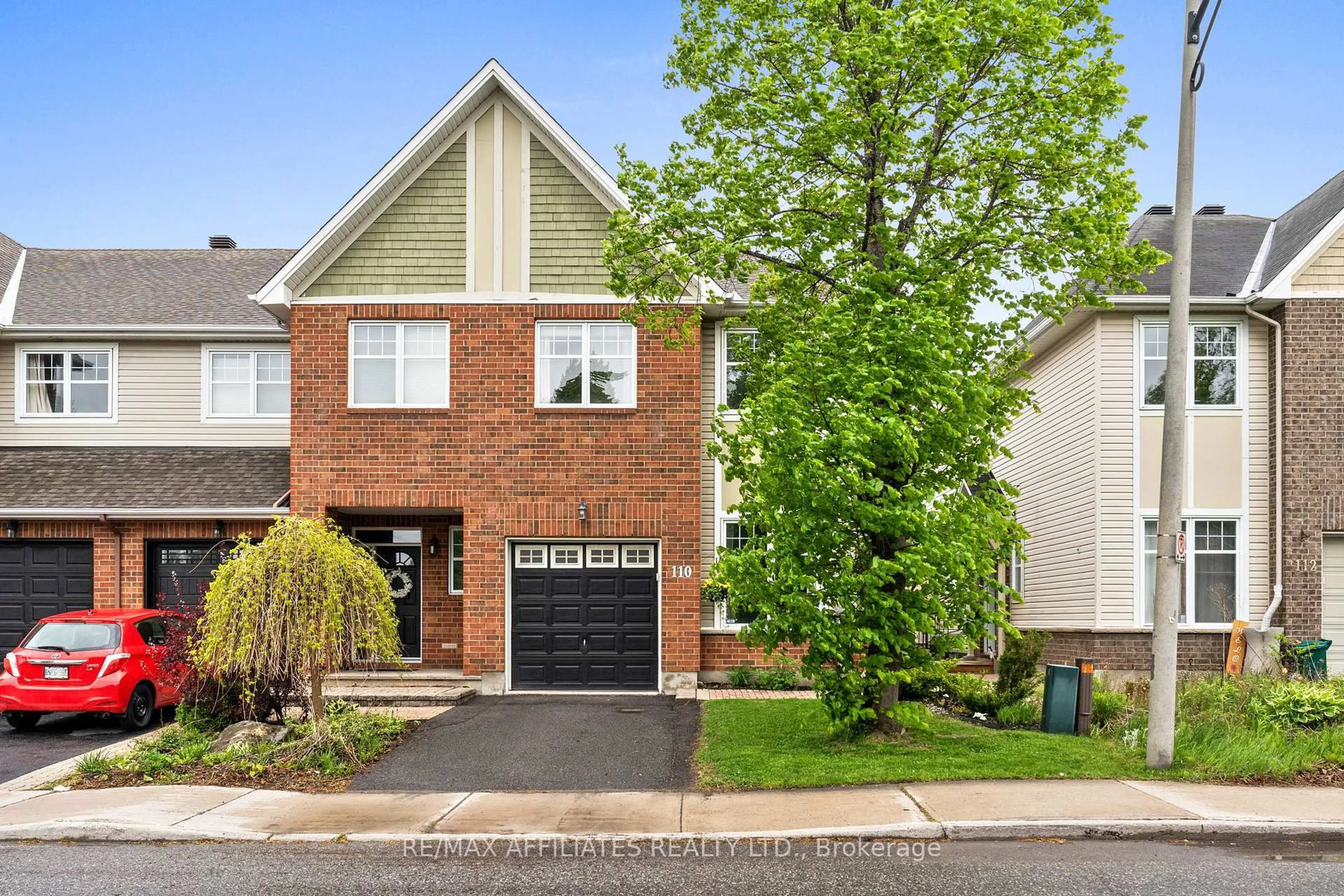 Home with brick exterior material, street for 110 Waterbridge Dr, Ottawa Ontario K2G 7C2