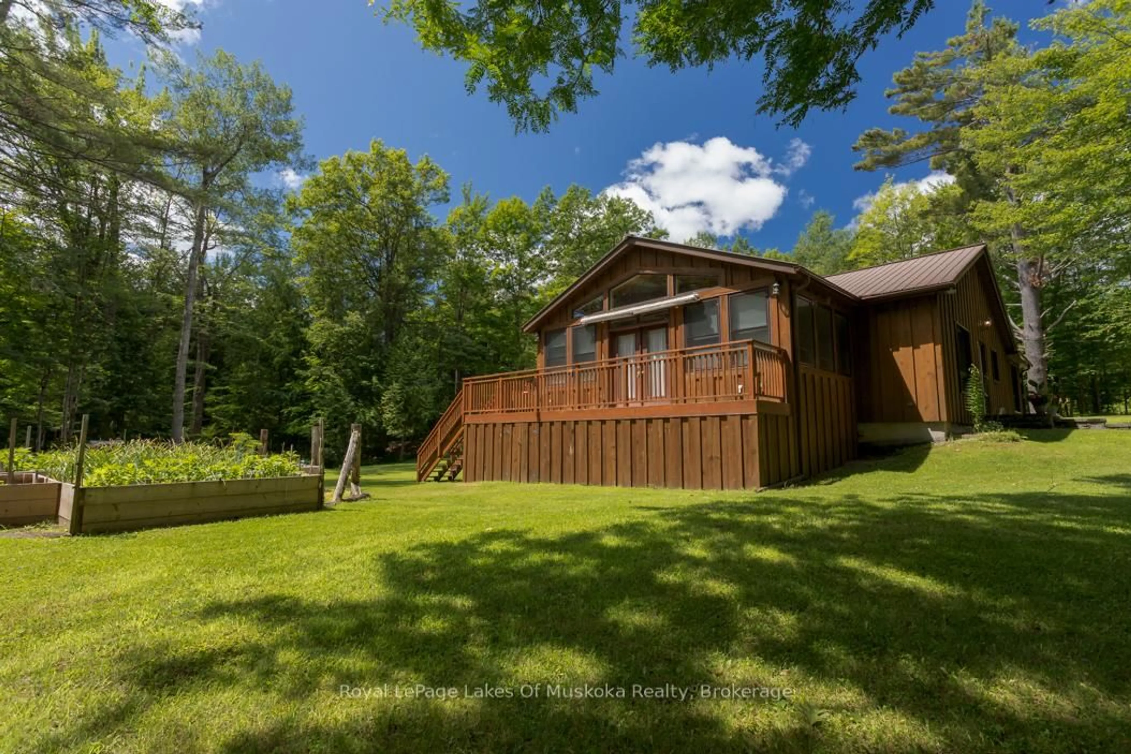 A pic from outside/outdoor area/front of a property/back of a property/a pic from drone, forest/trees view for 10 Muskoka Pines Rd, Bracebridge Ontario P1L 0A1