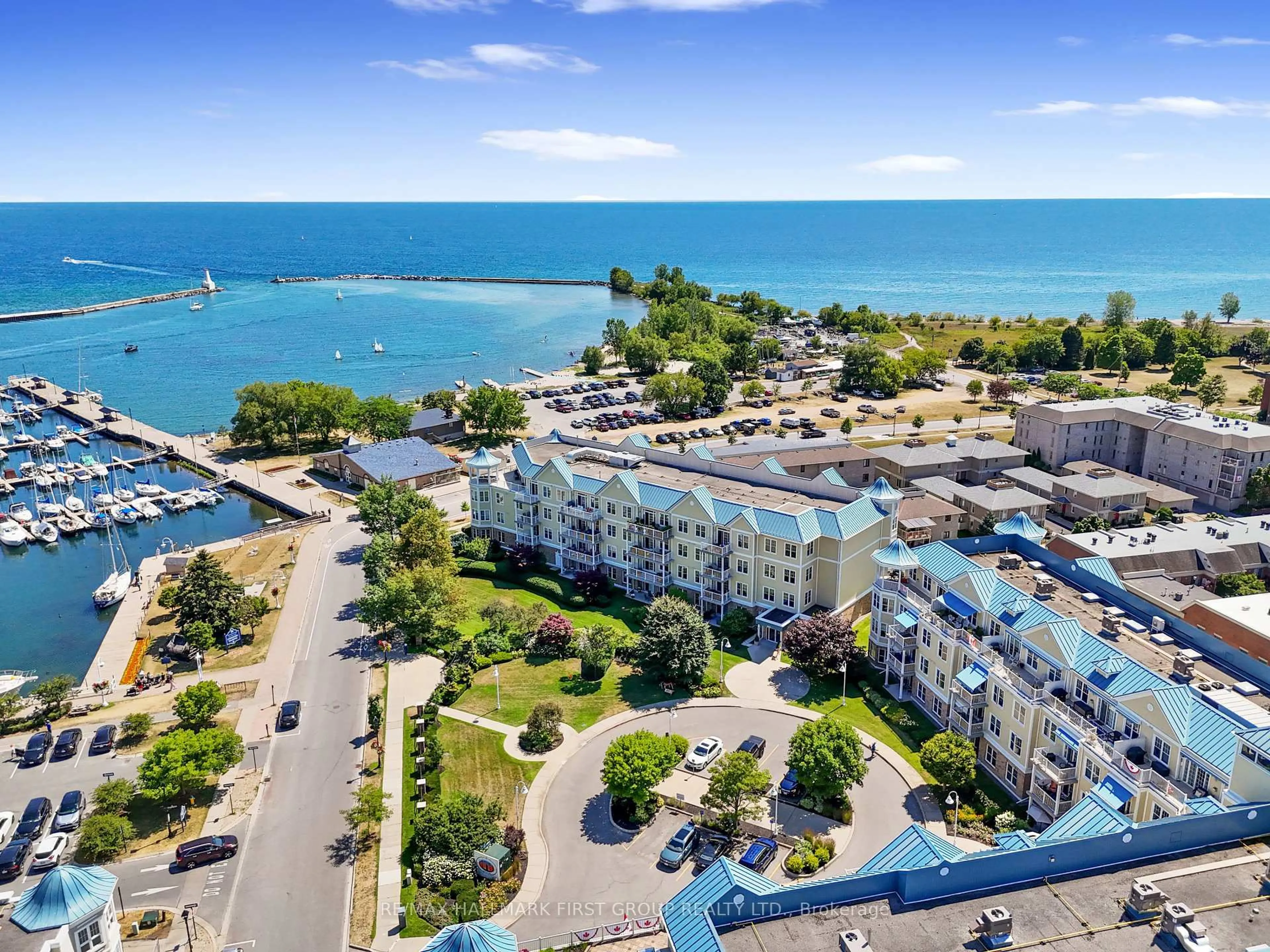 A pic from outside/outdoor area/front of a property/back of a property/a pic from drone, water/lake/river/ocean view for 125 Third St #103, Cobourg Ontario K9A 5W9