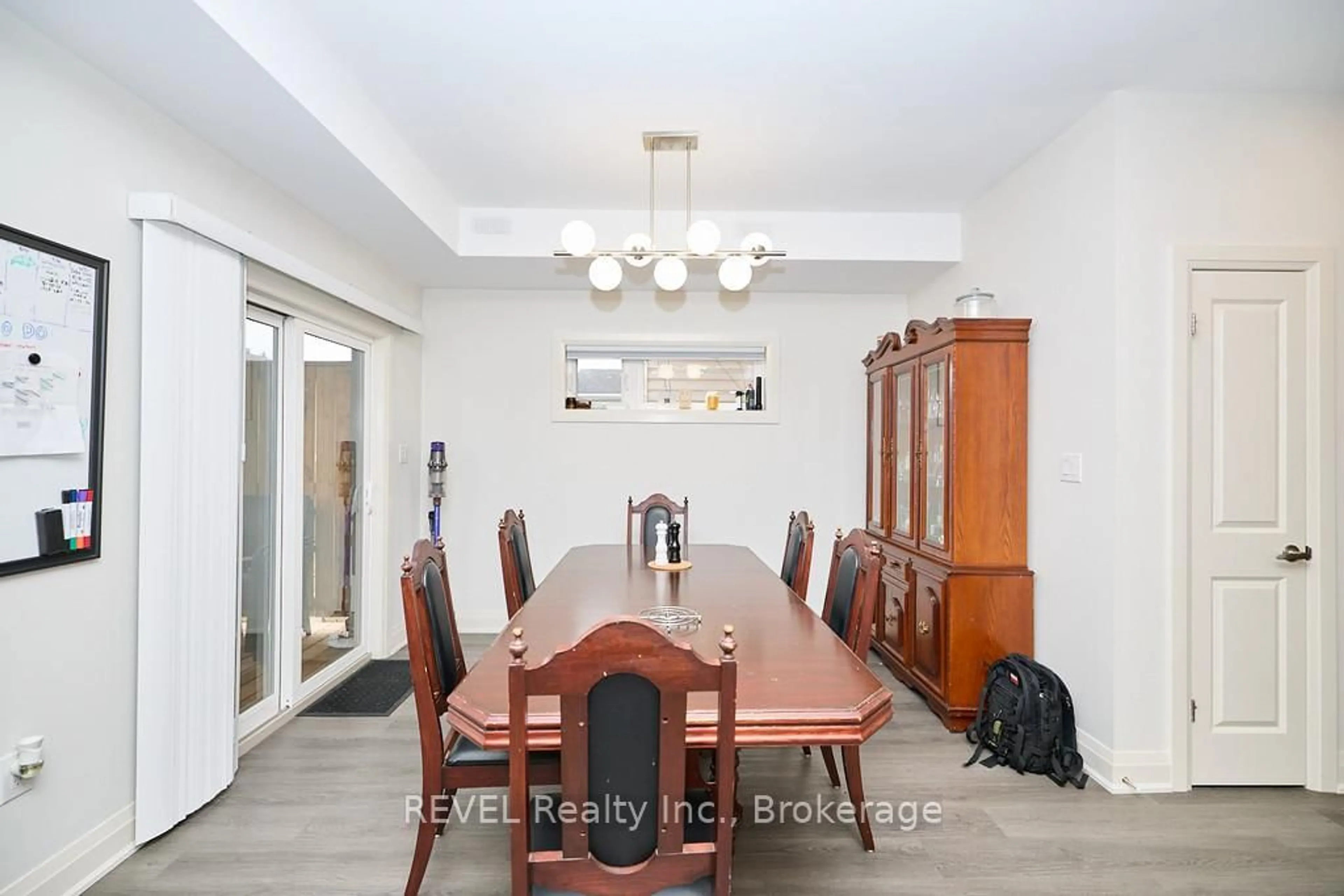 Dining room, wood/laminate floor for 8 Nash St, St. Catharines Ontario L2S 1B5