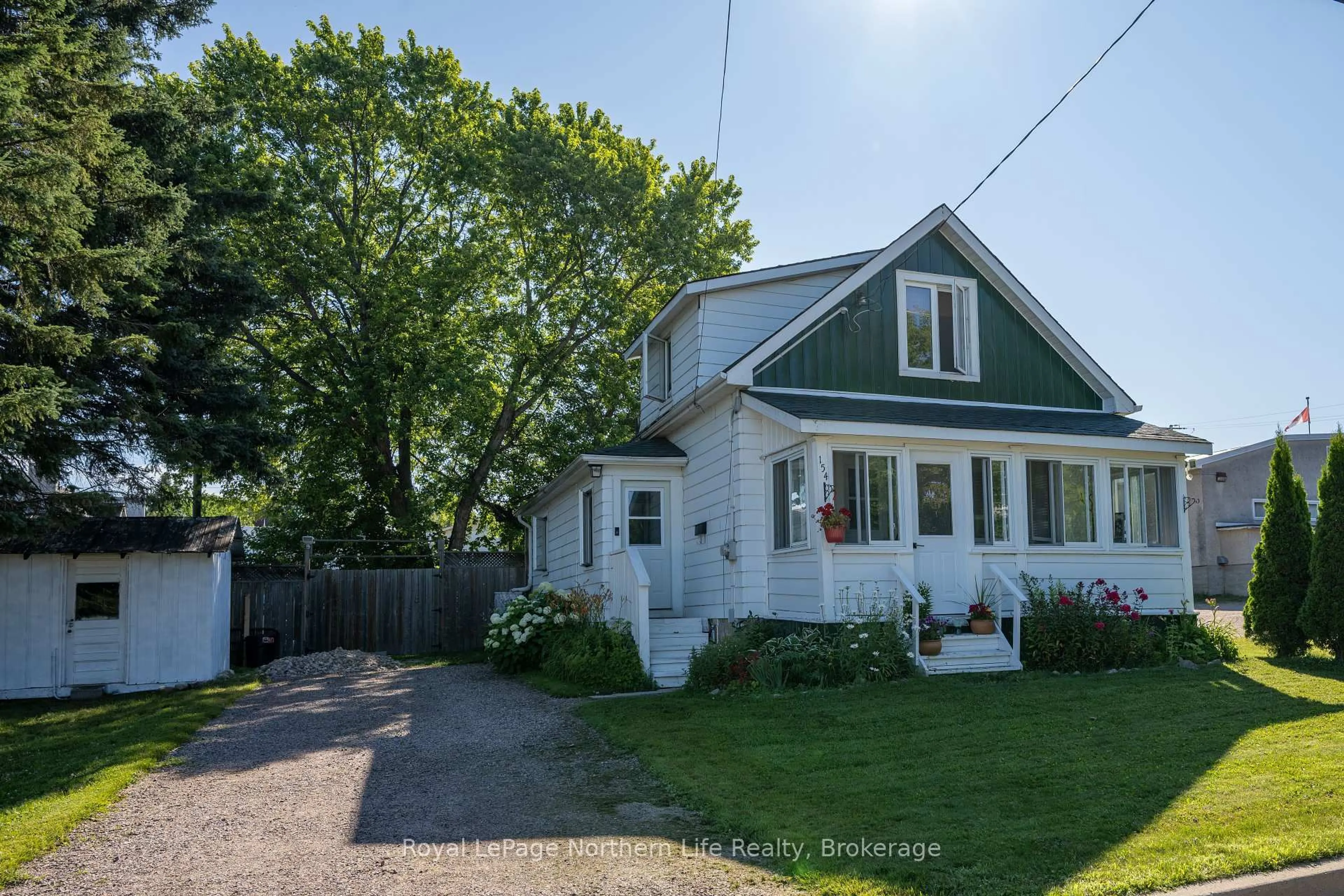 A pic from outside/outdoor area/front of a property/back of a property/a pic from drone, street for 154 Edward St, Powassan Ontario P0H 1Z0