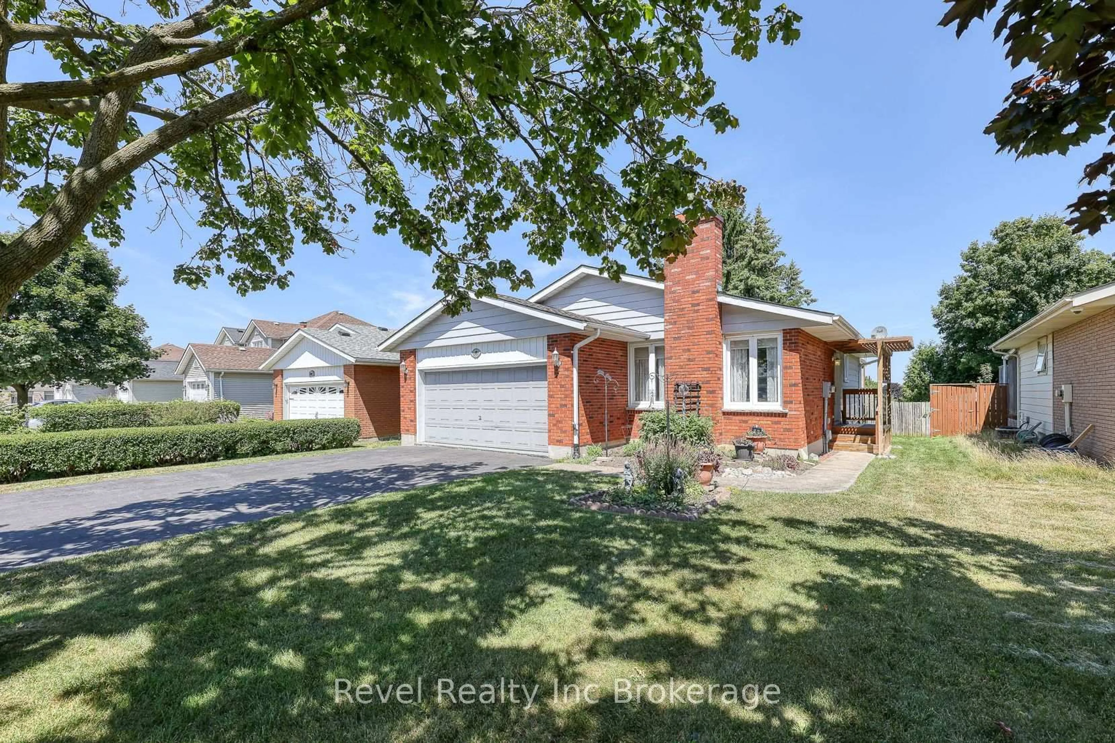 Home with brick exterior material, street for 1051 Devonshire Ave, Woodstock Ontario N4S 5S1