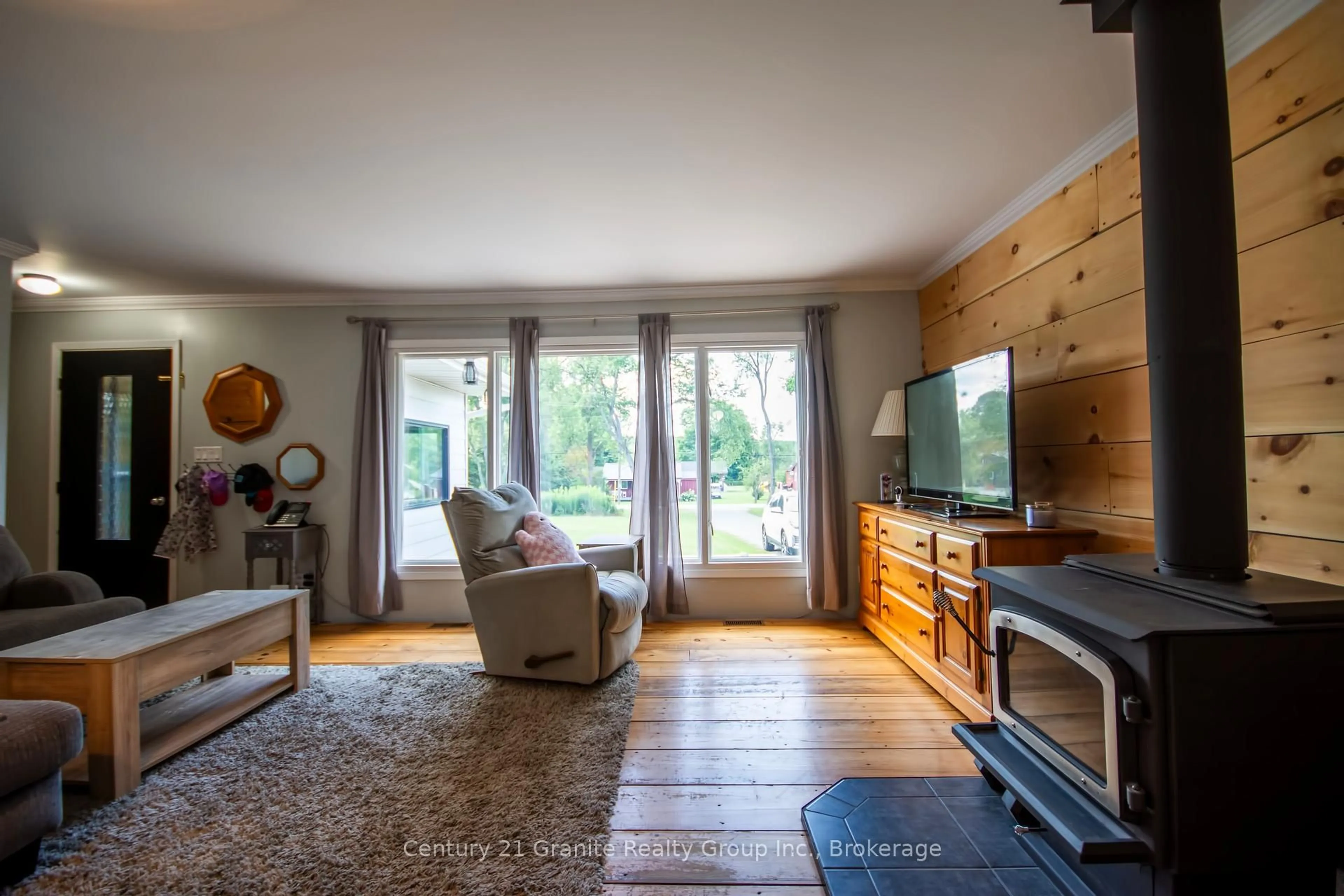 Living room with furniture, wood/laminate floor for 1229 Spring Valley Rd, Minden Hills Ontario K0M 2K0