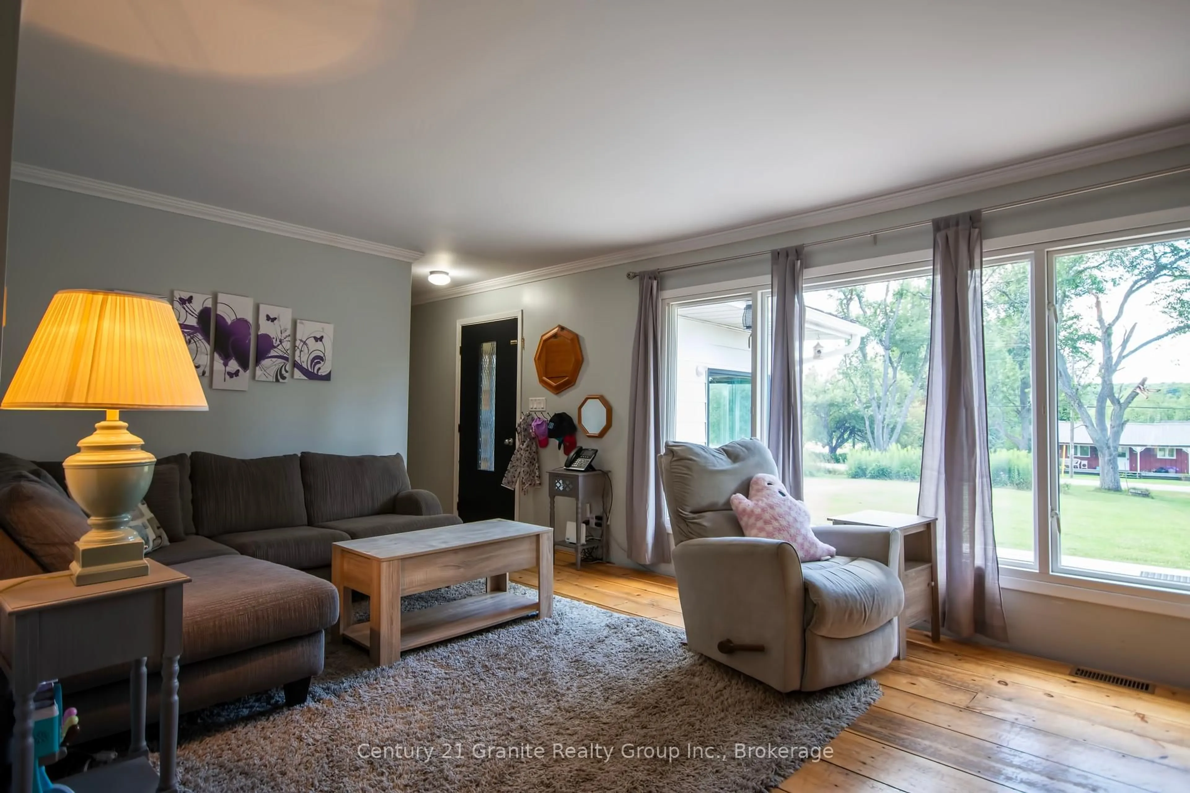 Living room with furniture, wood/laminate floor for 1229 Spring Valley Rd, Minden Hills Ontario K0M 2K0