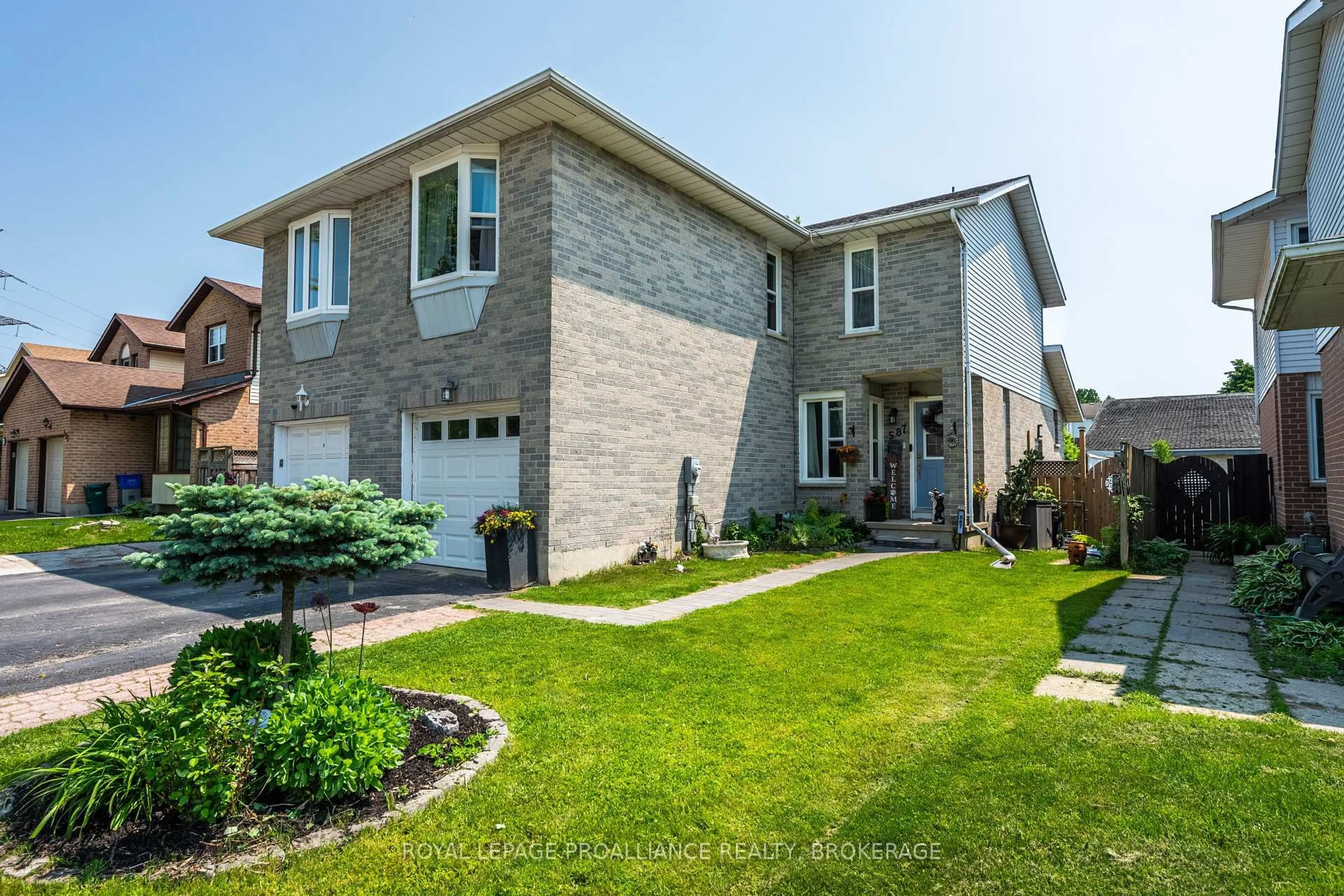Home with brick exterior material, street for 587 Davis Dr, Kingston Ontario K7M 7Y4