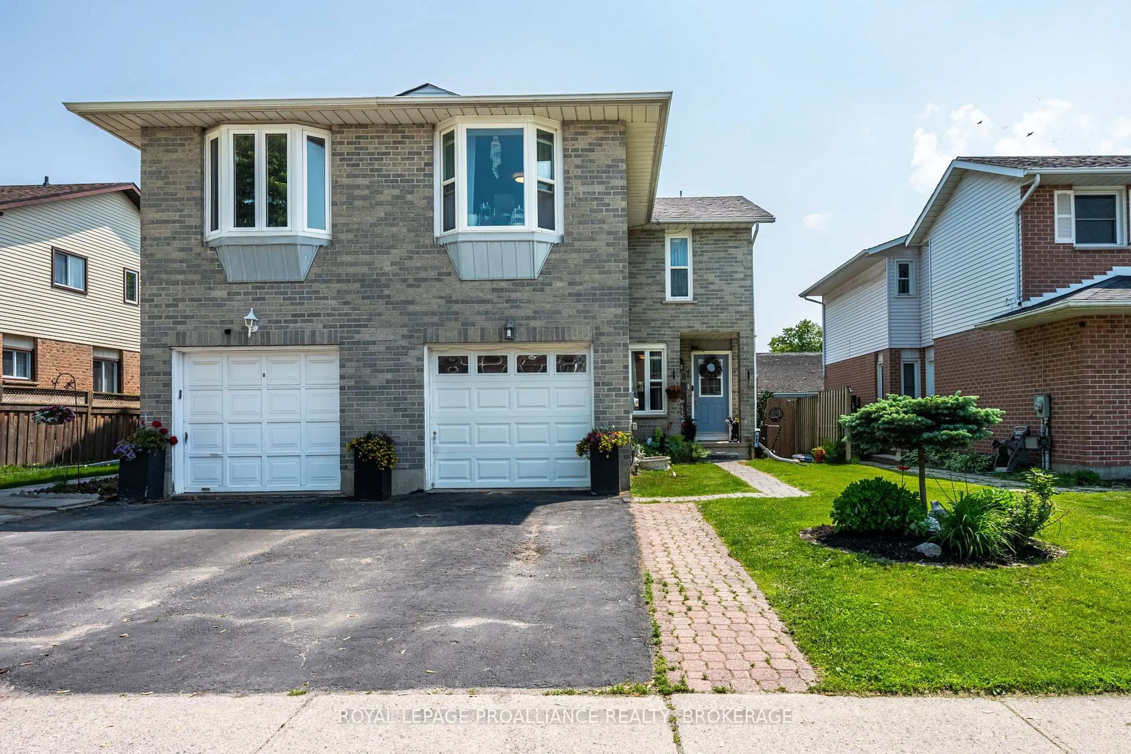Home with brick exterior material, street for 587 Davis Dr, Kingston Ontario K7M 7Y4