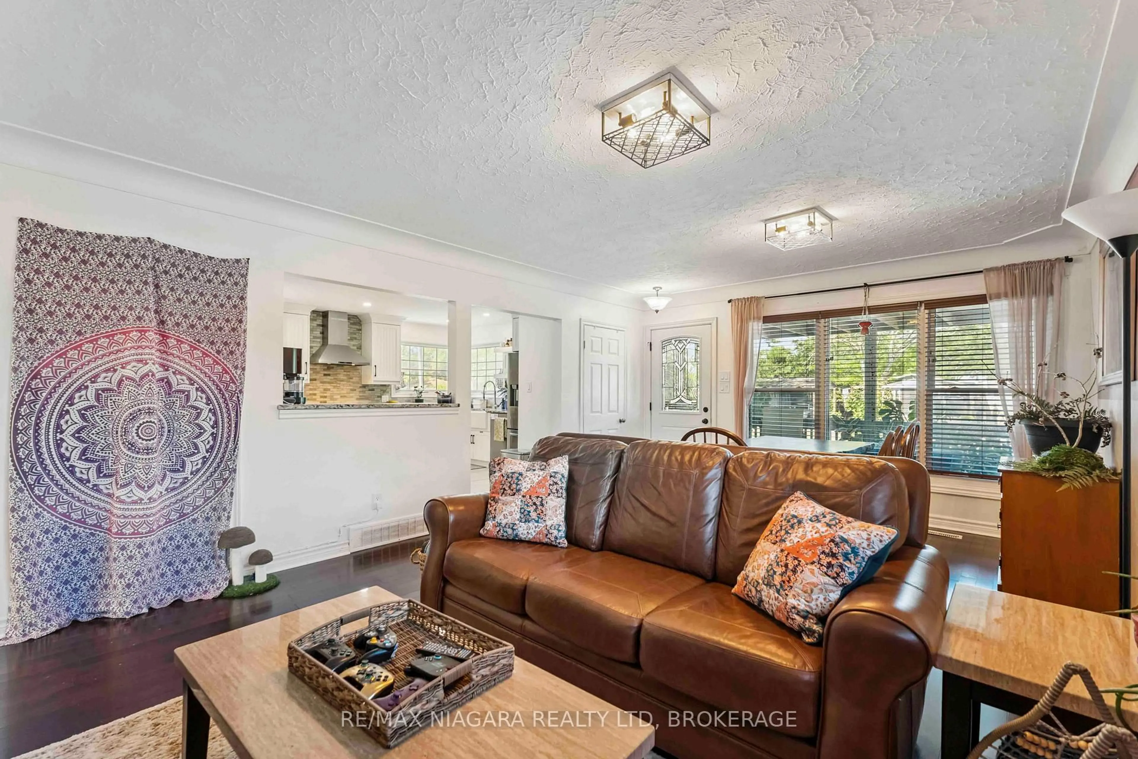 Living room with furniture, unknown for 7452 Dorchester Rd, Niagara Falls Ontario L2G 5W1
