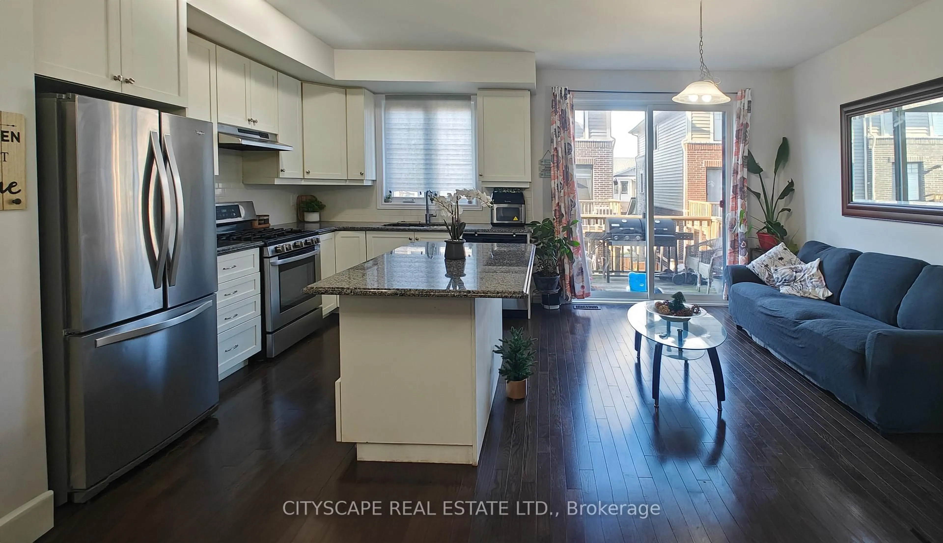 Open concept kitchen, wood/laminate floor for 74 Esplanade Lane, Grimsby Ontario L3M 0H2